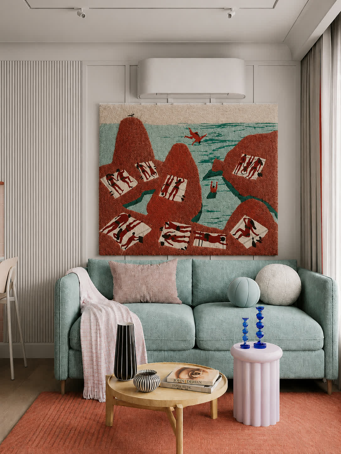 A hand-tufted wool bathers scene in terracotta and sea green hung from a rod above a mint bouclé sofa