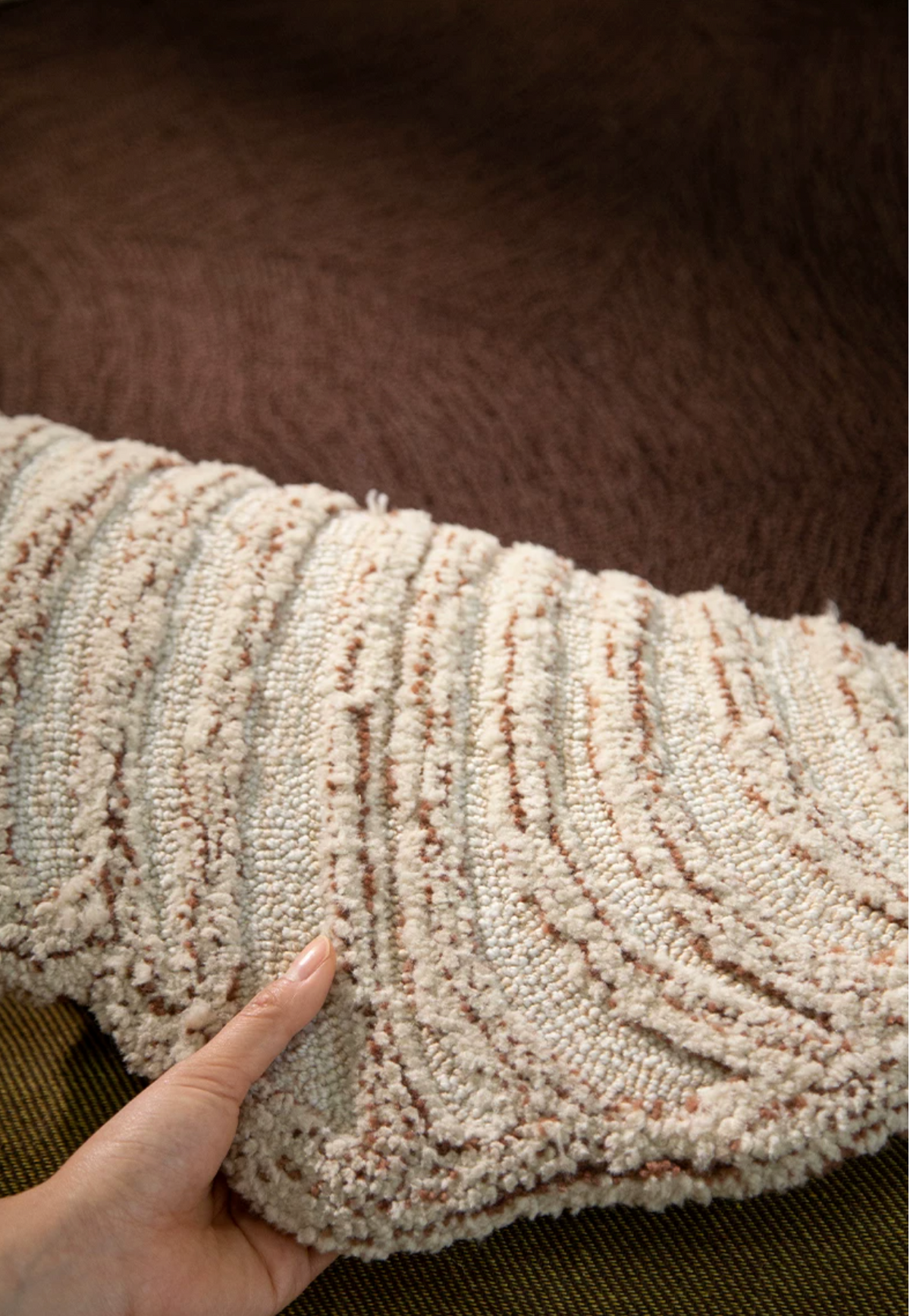 Hewn Earth Studio Camellia rug in Cocoa Bloom with a detailed floral pattern, shown from the back view.