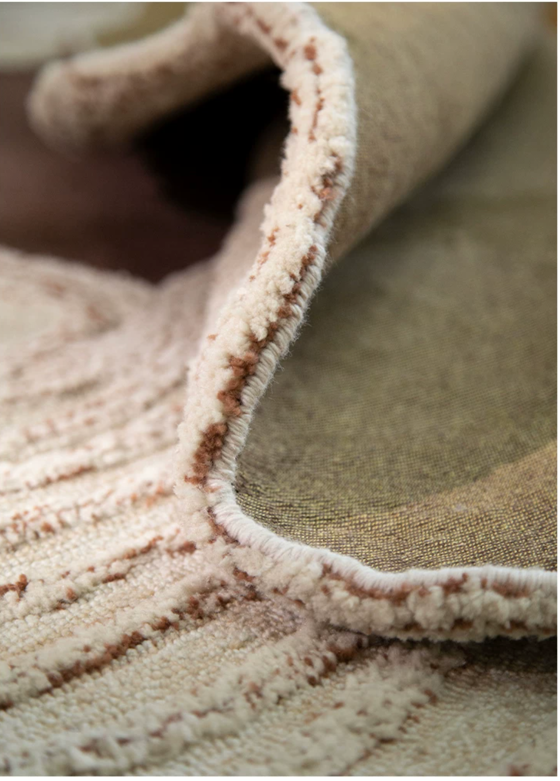 Hewn Earth Studio Camellia rug in Cocoa Bloom pattern, featuring intricate floral design on soft woven fabric.