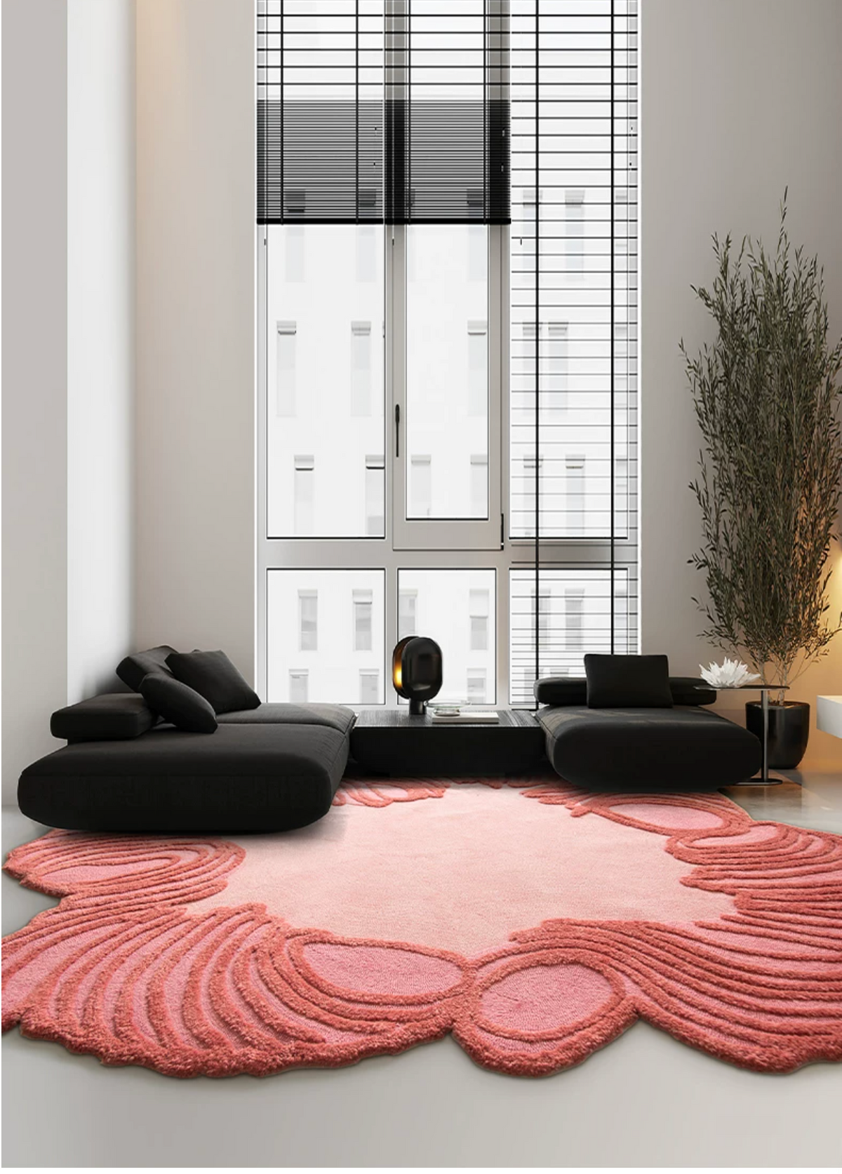 Hewn Earth Studio Camellia rug in coral bloom with floral pattern, displayed in a room setting.