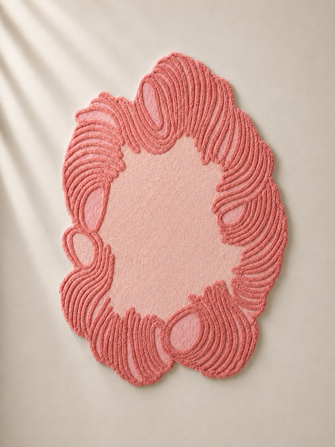 Hewn Earth Studio Camellia rug featuring a vibrant coral bloom design with intricate floral patterns on a soft background.