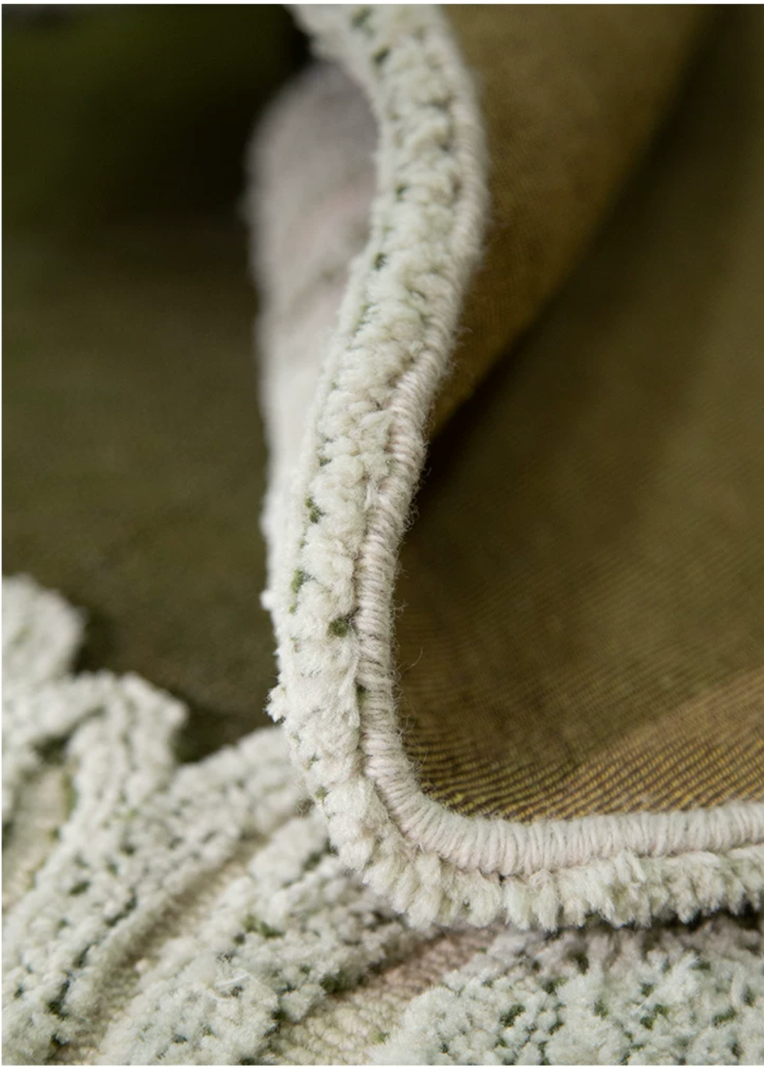 Hewn Earth Studio Camellia moss bloom rug featuring a hand-printed design of blooming moss flowers on a soft, textured surface.
