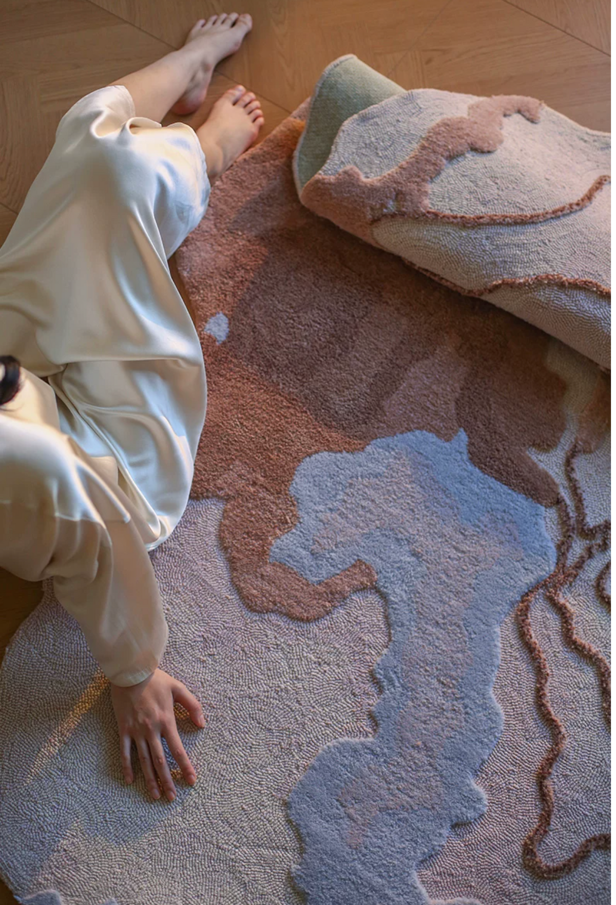 Hewn Earth Studio Delta terracotta rug with intricate patterns, showing the back side of the woven textile.