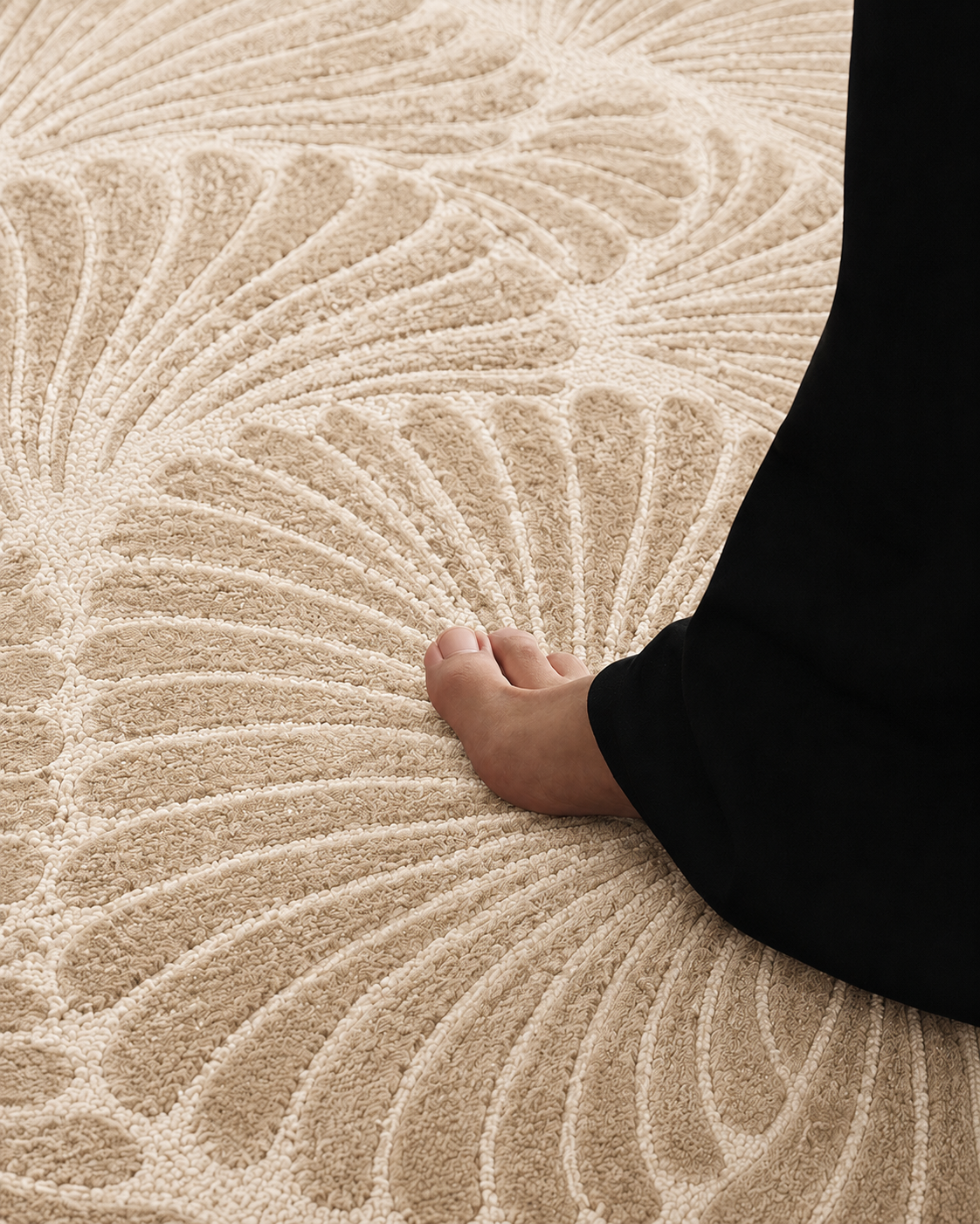 Hewn Earth Studio Frond rug in sand color displayed on a table, showcasing textured woven design and natural aesthetic.