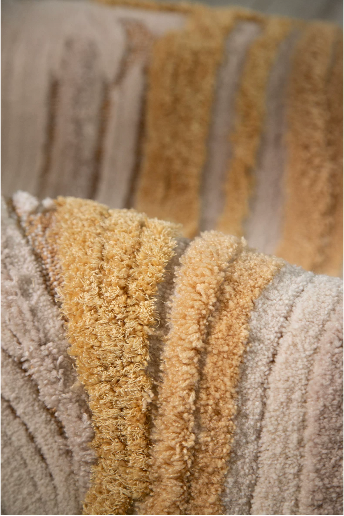 Close-up of Hewn Earth Studio's Lode Rug in Gilt, showcasing intricate weaving and rich textured design.