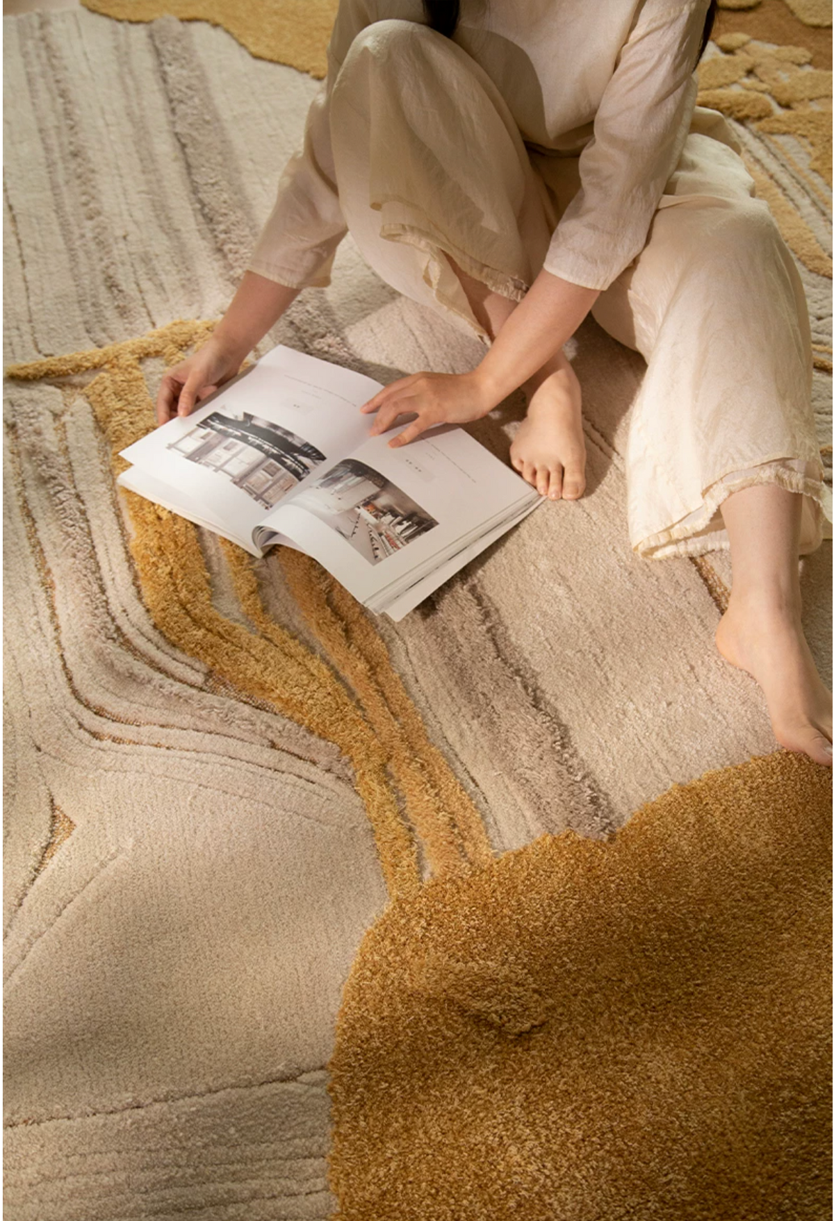 Hewn Earth Studio Lode rug with intricate gilt design, showcasing detailed pattern and rich texture in a stylish interior setting.