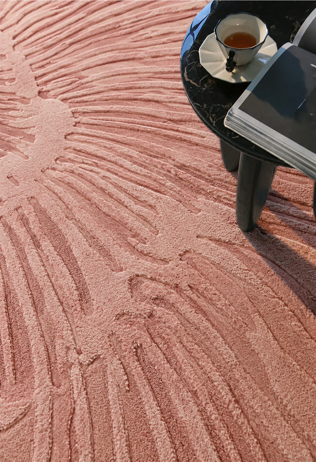 Hewn Earth Studio Lotus blush pink rug with intricate handwoven design, soft and stylish for home decor.