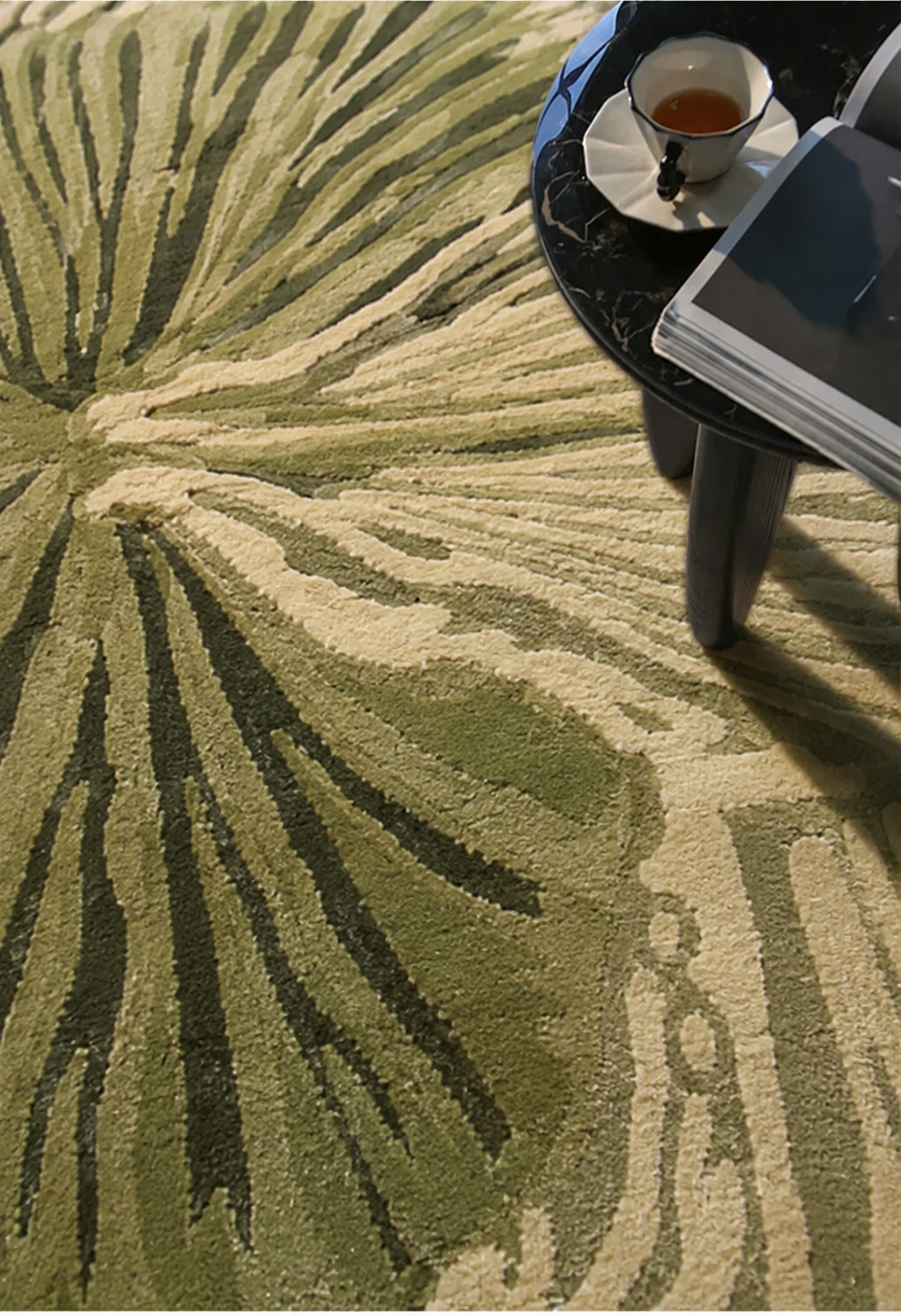 Hewn Earth Studio Lotus rug in fern green, featuring intricate woven design, suitable for living room or bedroom decor.