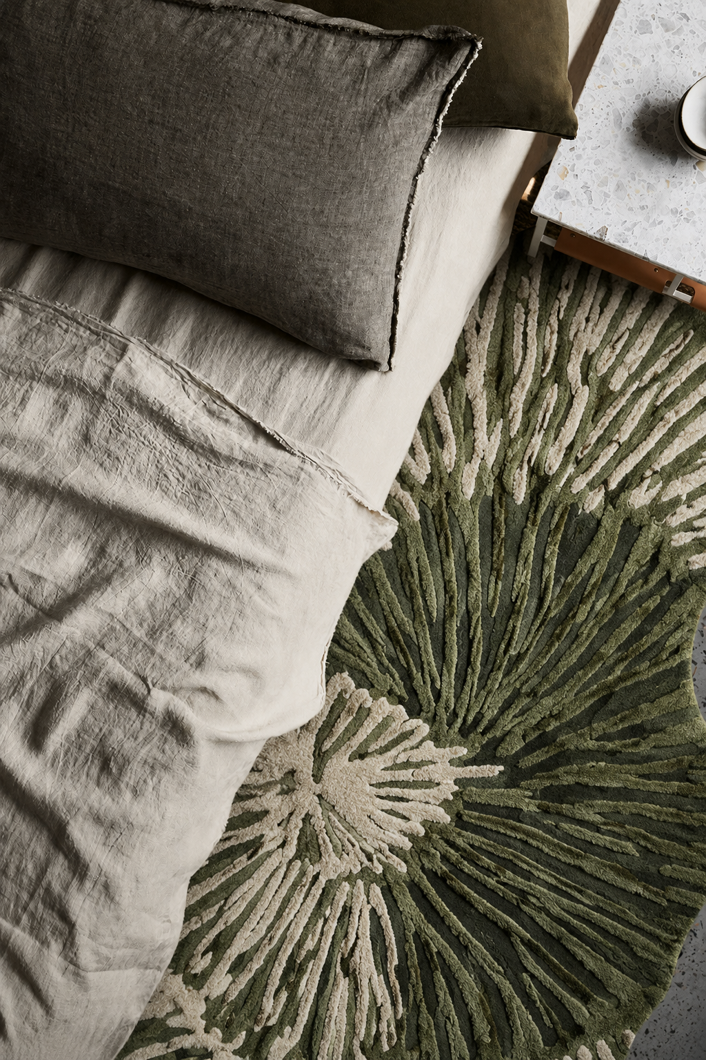 Hewn Earth Studio Solene rug featuring marigold and fern bloom pattern, vibrant woven textile for living room decor.