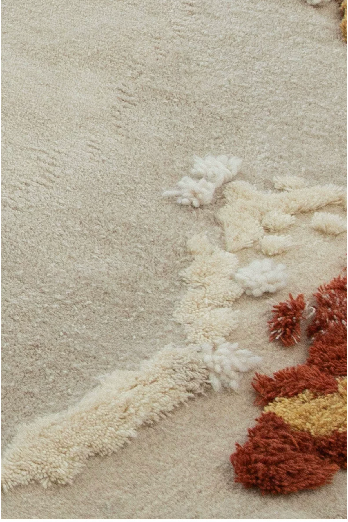 Close-up of Hewn Earth Studio Meadow autumn-themed rug showcasing detailed woven floral and leaf patterns.