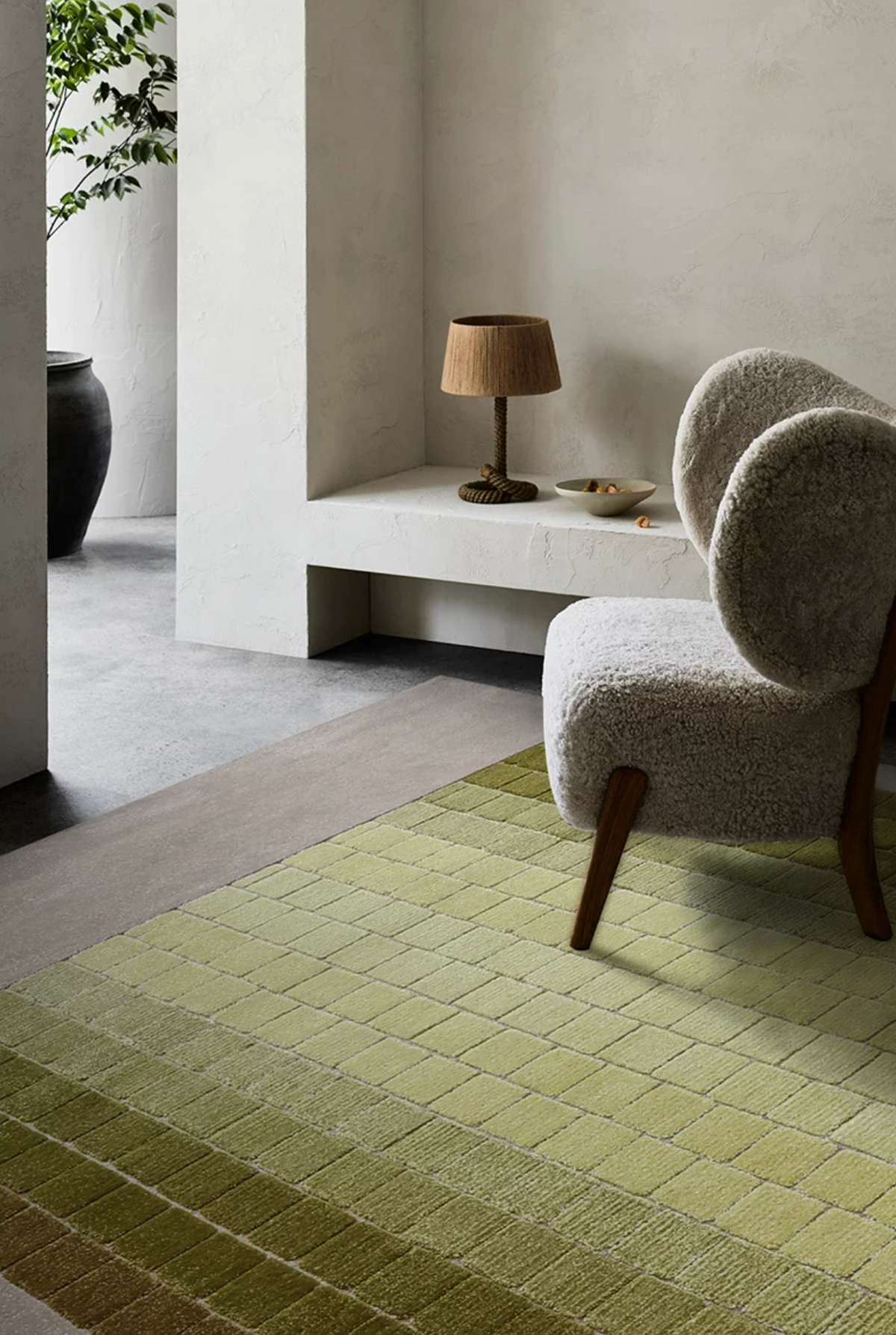 Hewn Earth Studio mosaic rug with moss green gradient pattern, showing detailed close-up of textured fabric and vibrant colors.