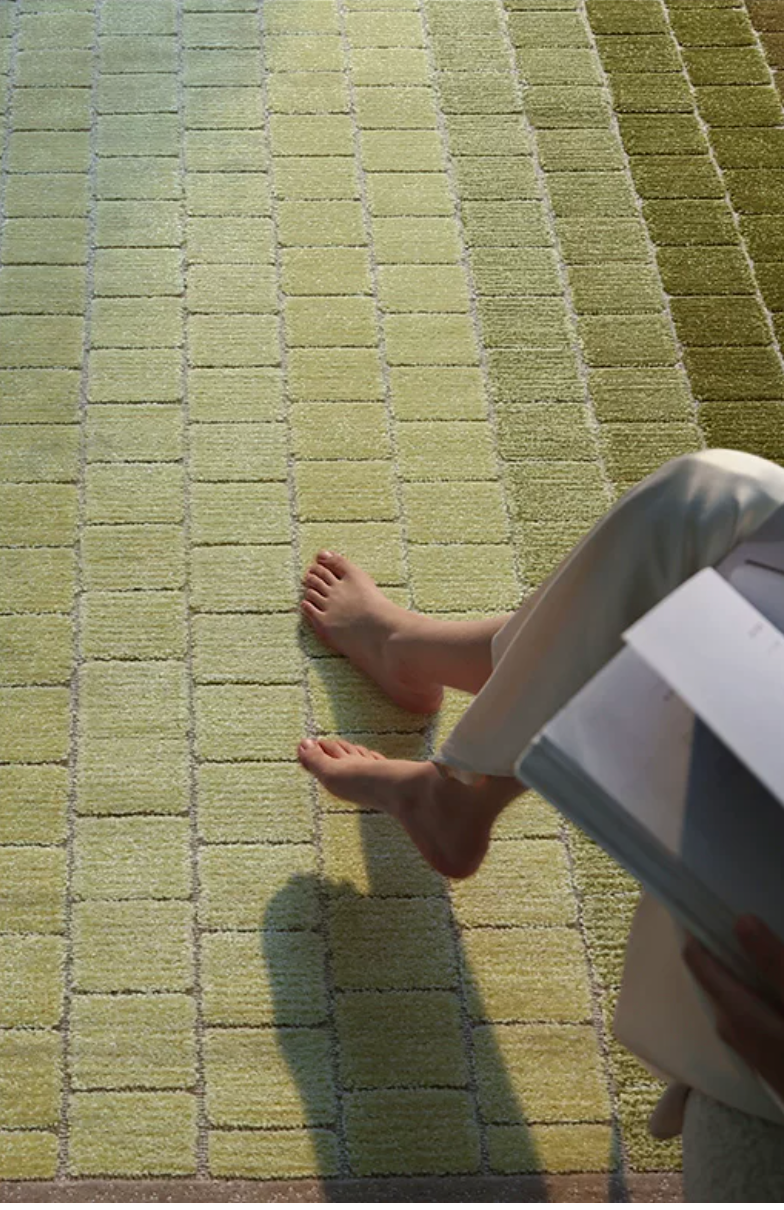 Hewn Earth Studio mosaic rug featuring a moss gradient design with intricate hand-crafted mosaic patterns.