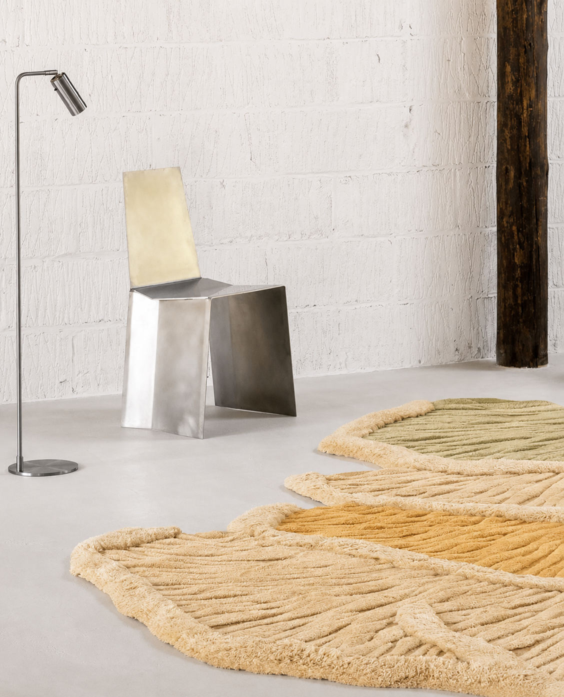 Hewn Earth Studio Palma meadow multi rug displayed on a chair, showcasing vibrant colors and intricate patterns.