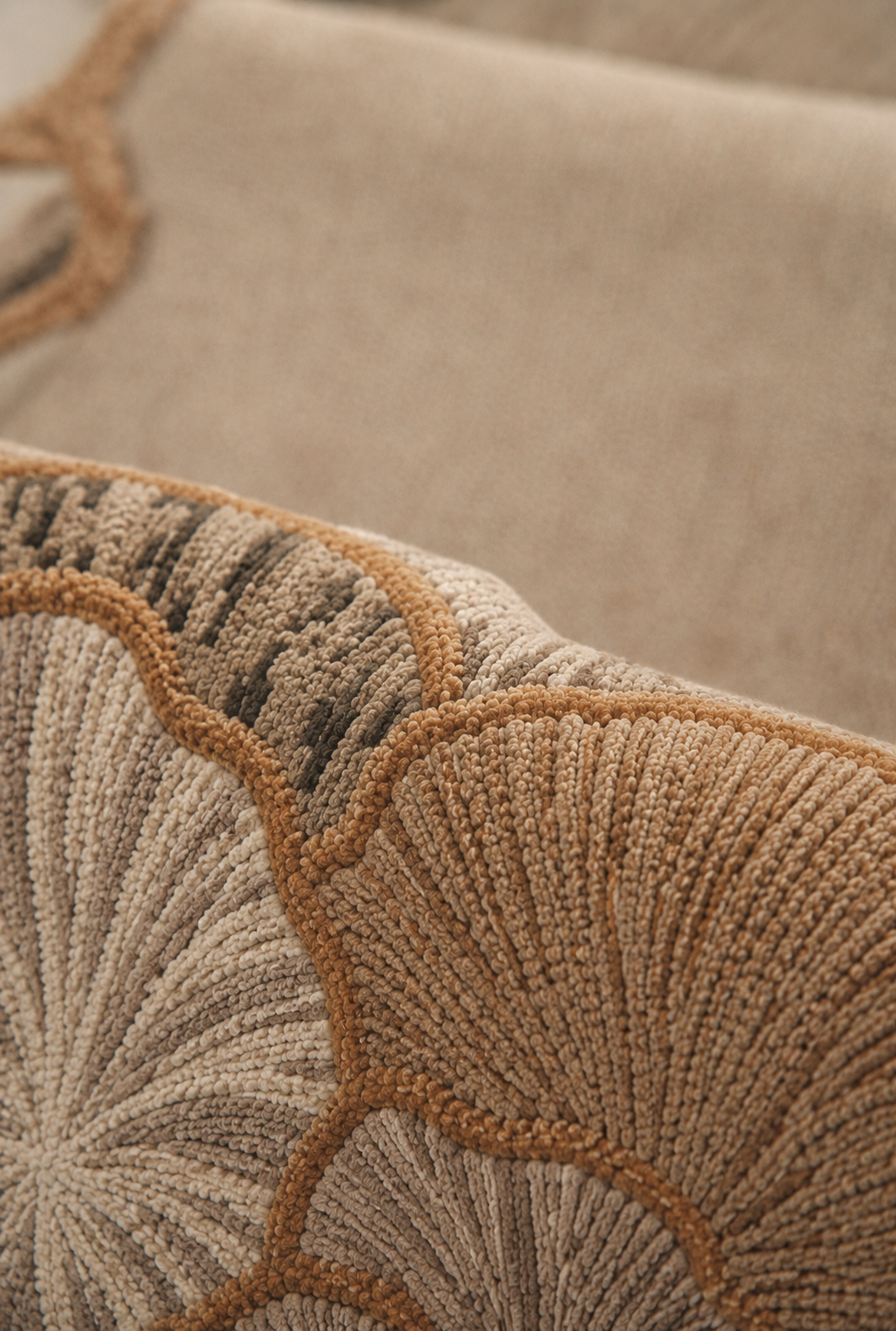 Hewn Earth Studio Petal rug featuring ash and rust tones with a soft, textured handwoven design.