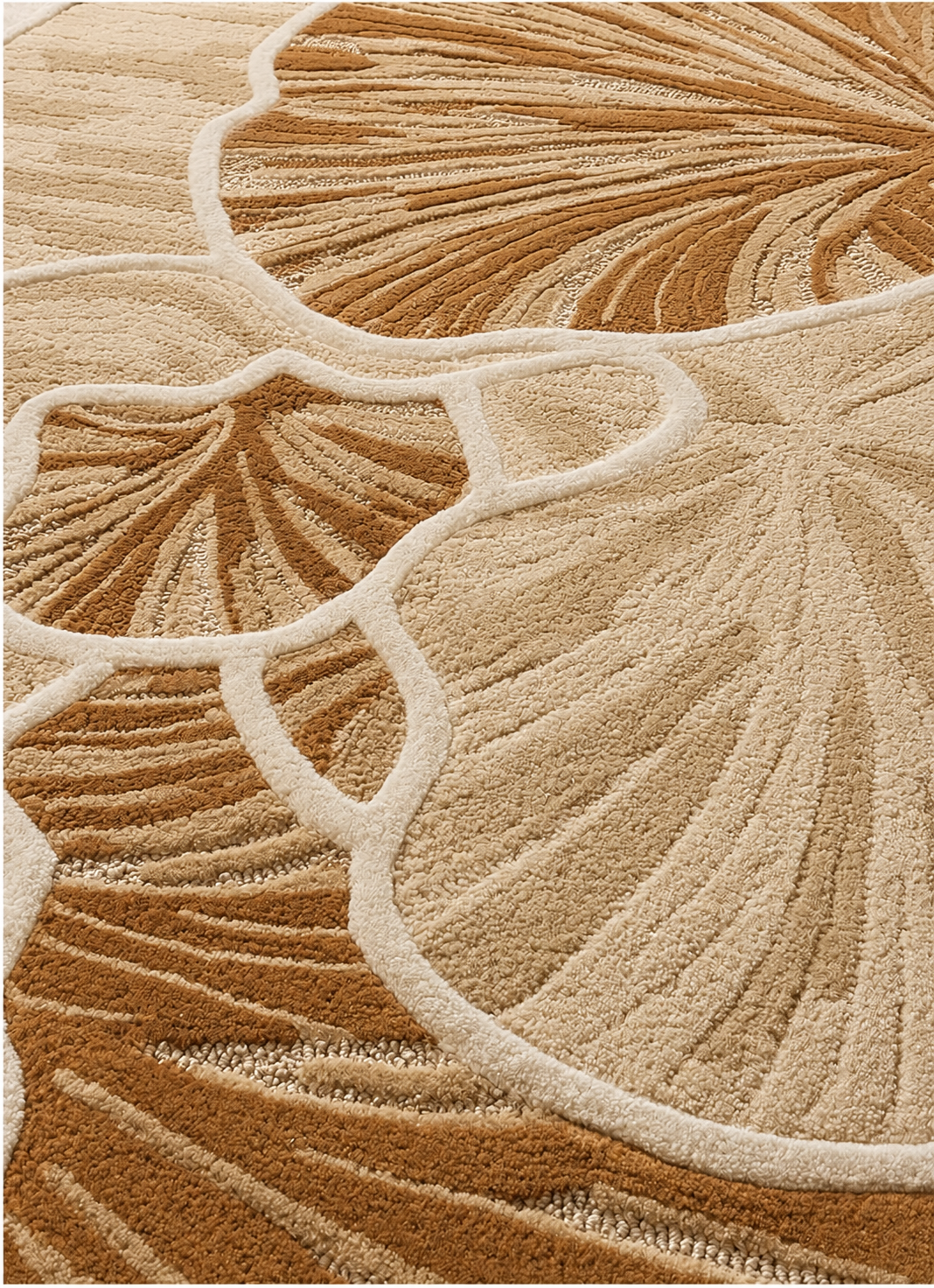 Hewn Earth Studio Petal rug in wheat and cream with a textured edge, showcasing soft, woven fabric and intricate pattern details.
