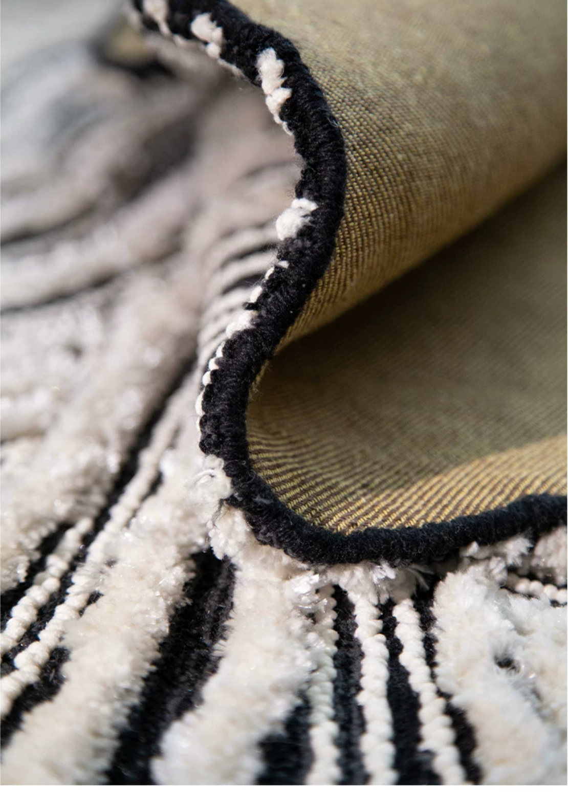 Hewn Earth Studio Plume rug with ink and bone pattern, featuring intricate design and soft texture for modern home decor.