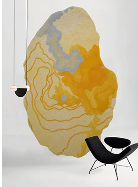 Hewn Earth Studio Strata Rug in Saffron with geometric pattern, placed on a living room floor.