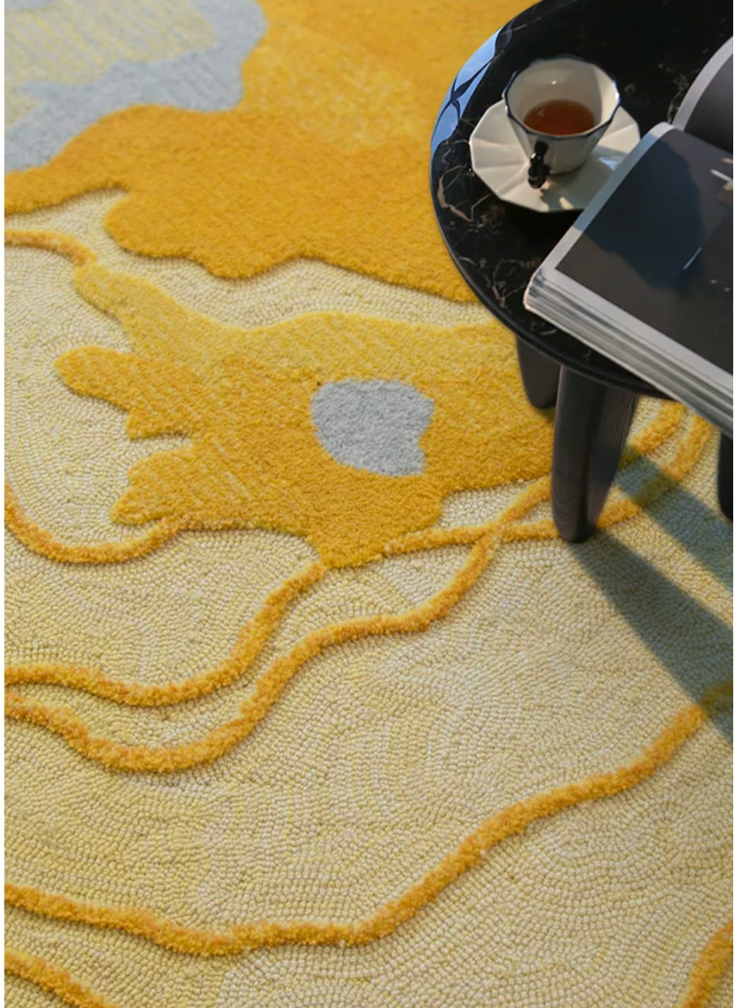 Hewn Earth Studio Strata rug in Saffron with intricate geometric patterns, displayed on a neutral background.