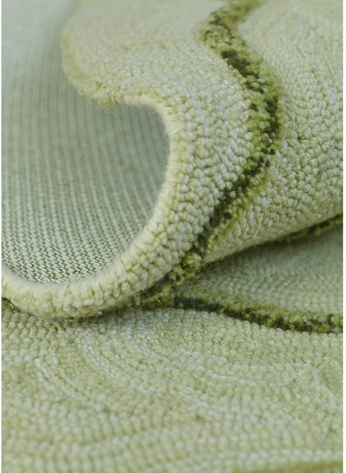 Hewn Earth Studio Strata rug in Verdant with a textured, layered pattern showcasing natural earthy tones and intricate design.