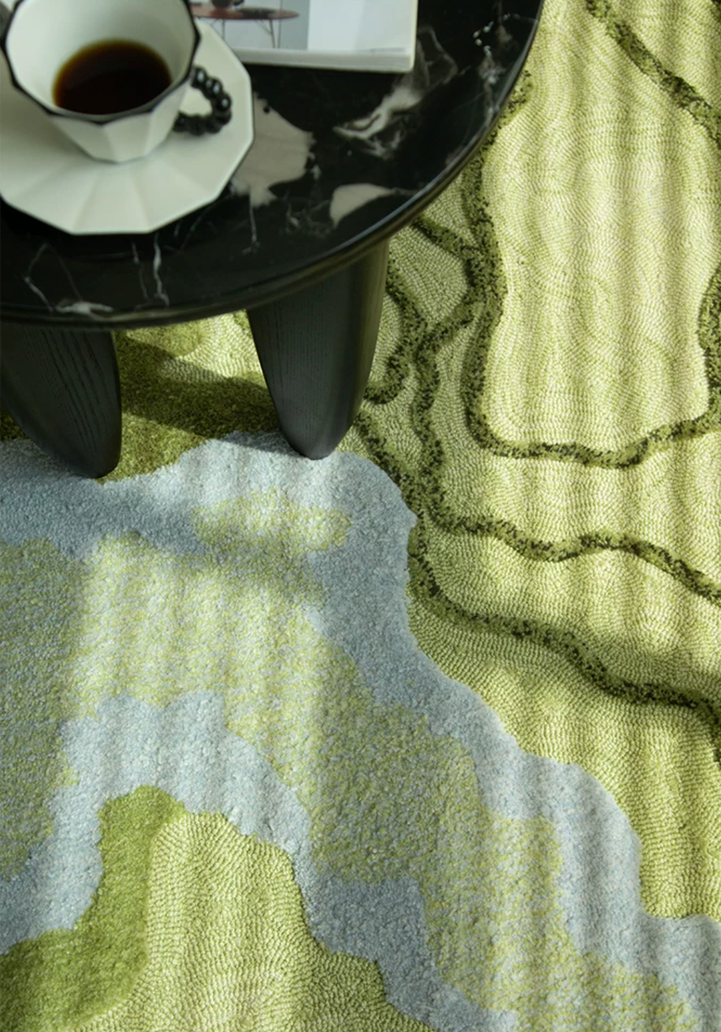 Side view of Hewn Earth Studio's Strata rug in Verdant, showcasing its textured, layered design and earthy green tones.