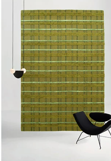 Hewn Earth Studio tartan moss rug with grid pattern, shown on a wooden floor, showcasing its textured fabric and vibrant colors.