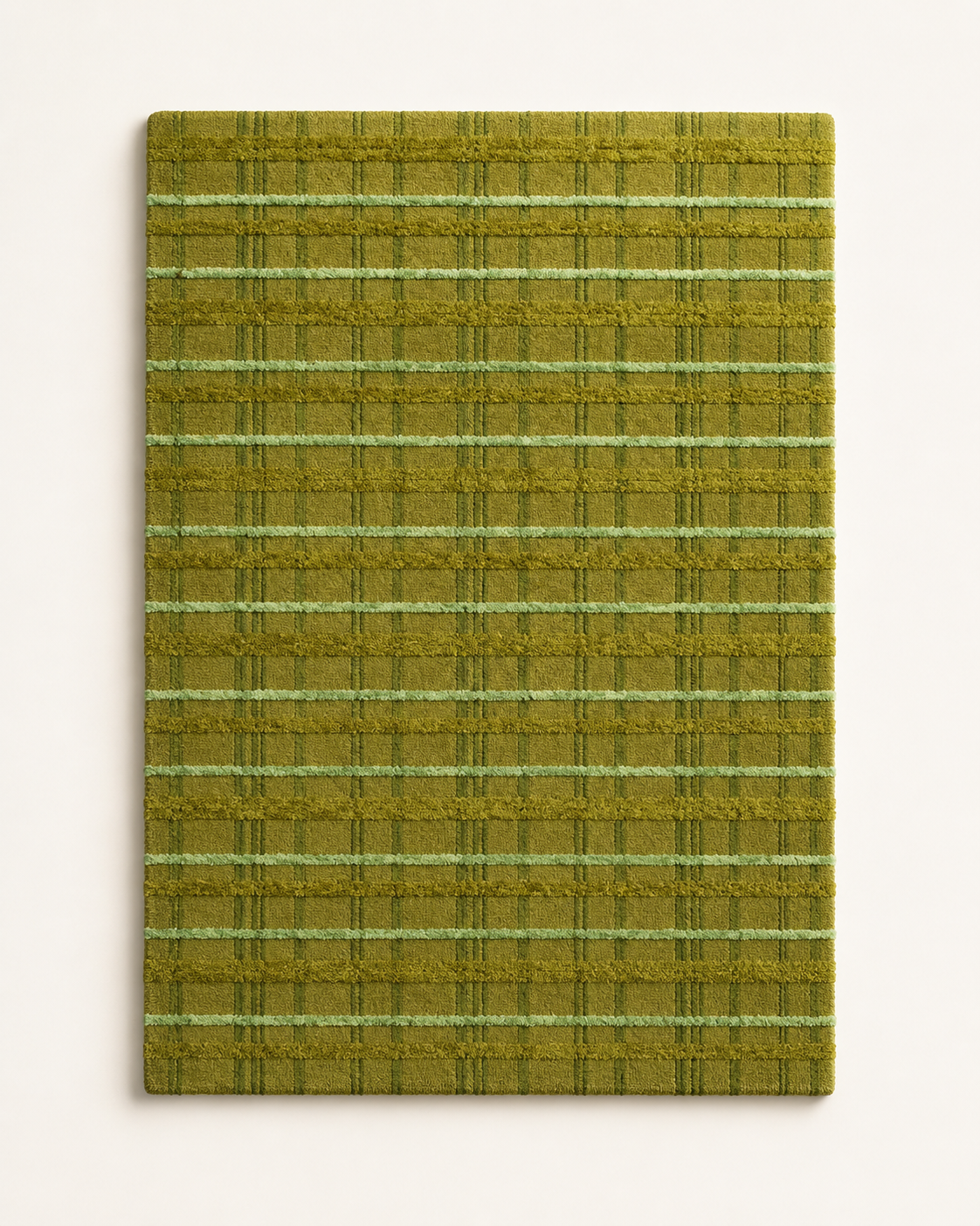 Hewn Earth Studio tartan moss rug with a grid pattern, showcasing a soft, textured design in a natural moss green color.