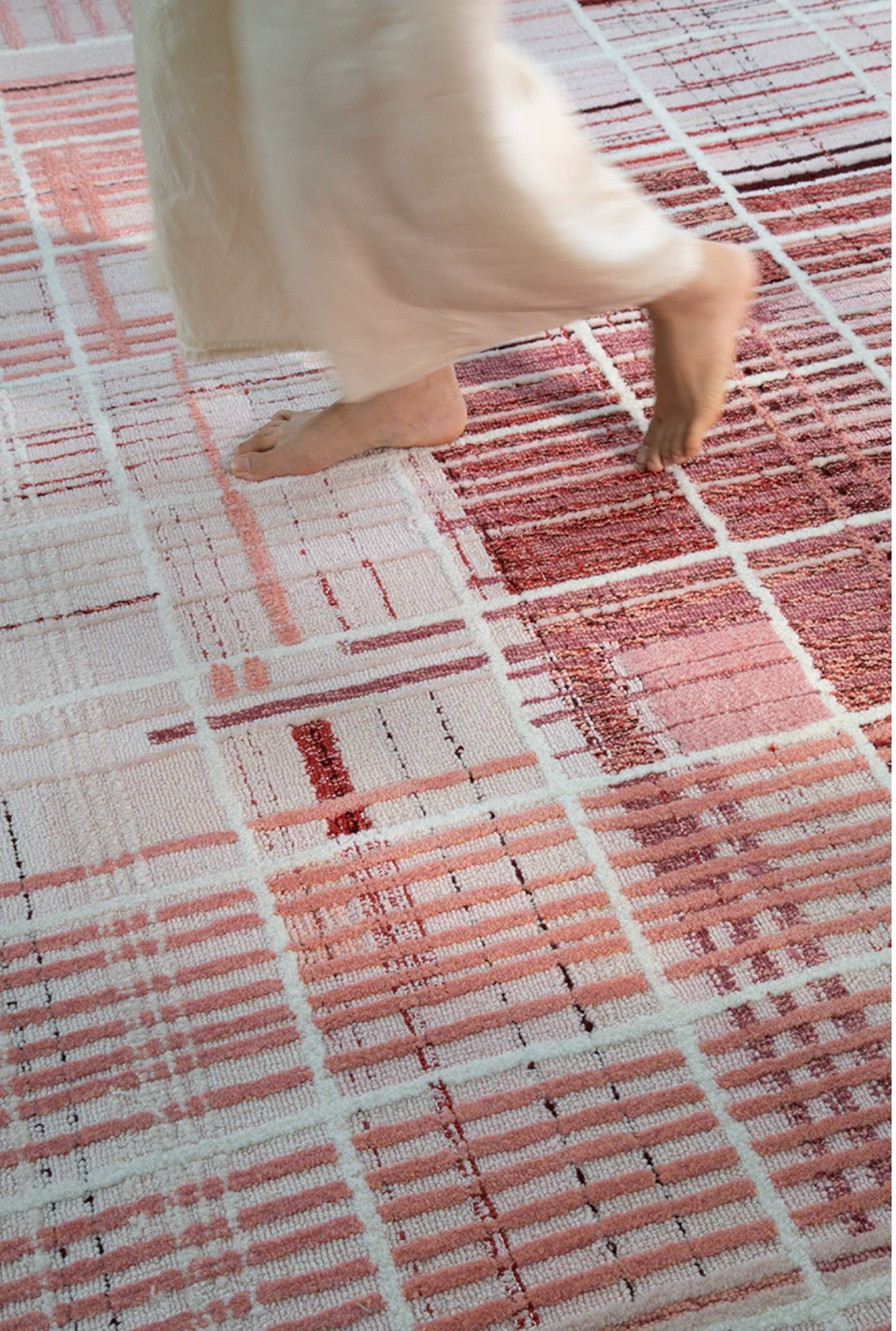 Hewn Earth Studio Weft rug in rose color, showcasing a textured woven design suitable for modern home decor.