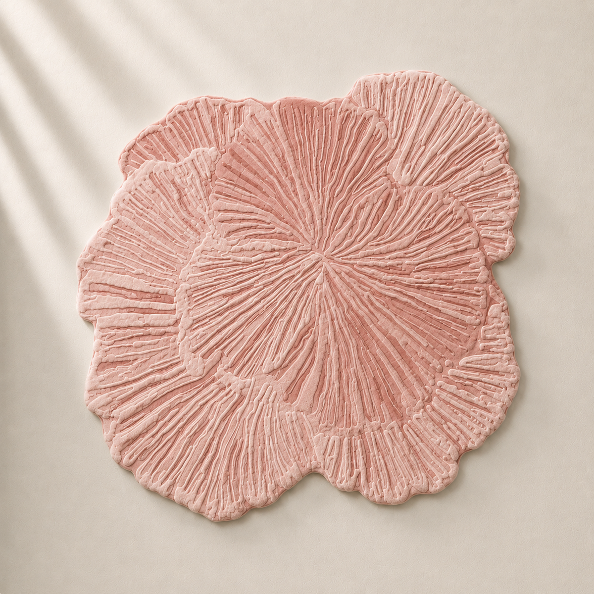 Hewn Earth Studio Solene rug featuring an intricate anemone floral design on a soft, textured fabric background.