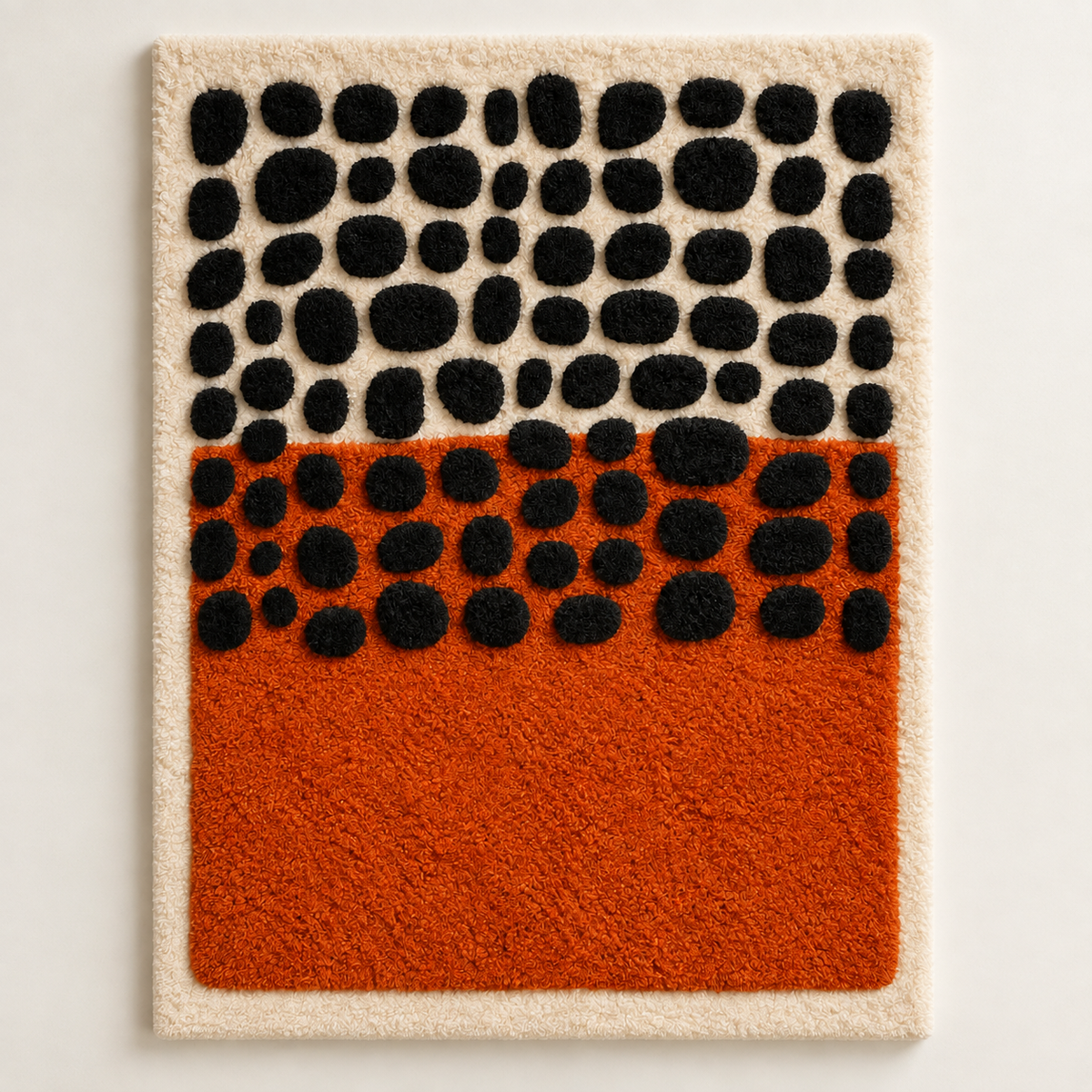 Hewn Earth wall art featuring black pebbles layered over a clay horizon, showcasing textured and earthy design elements.