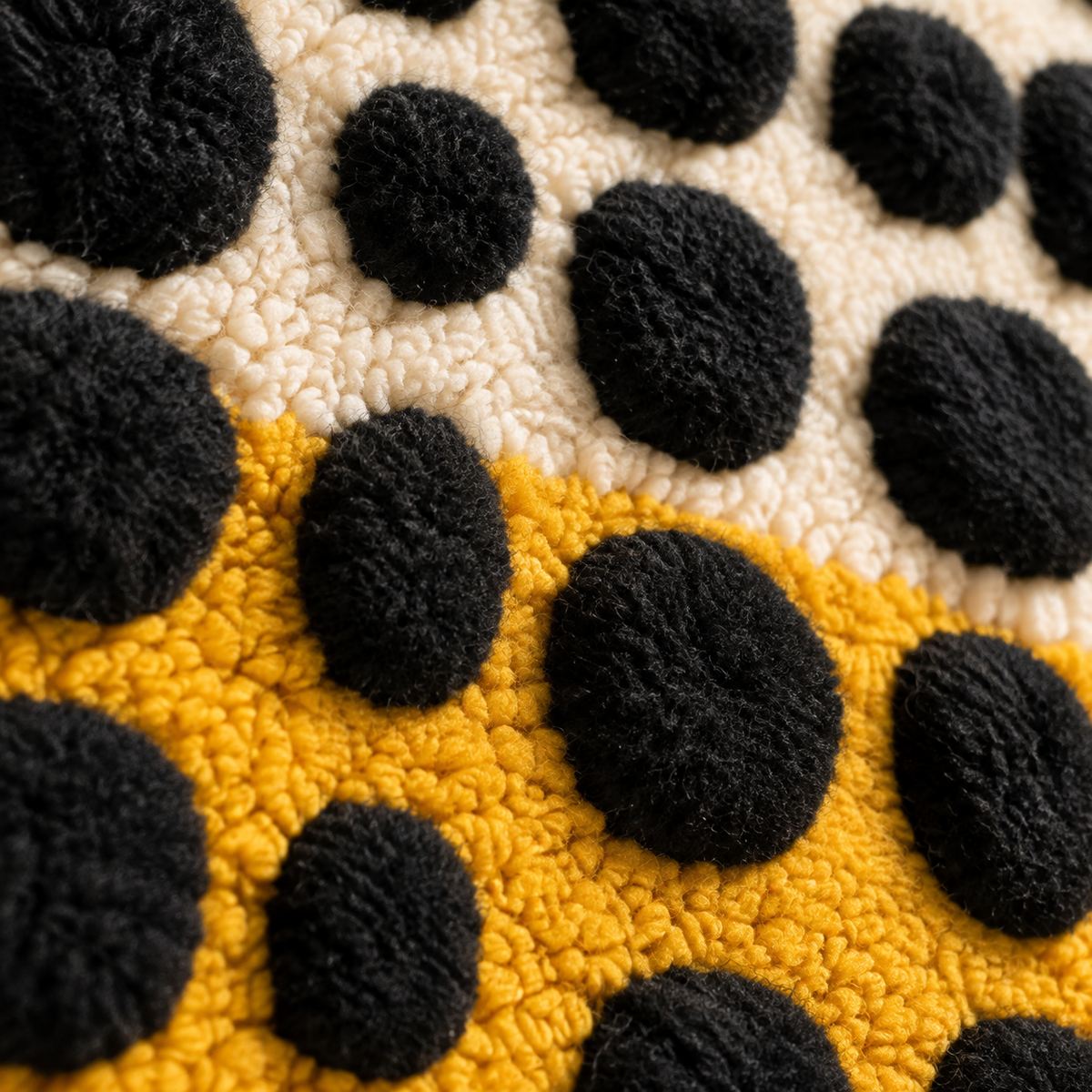 Black Pebbles over a Saffron Horizon — tufted wool texture detail