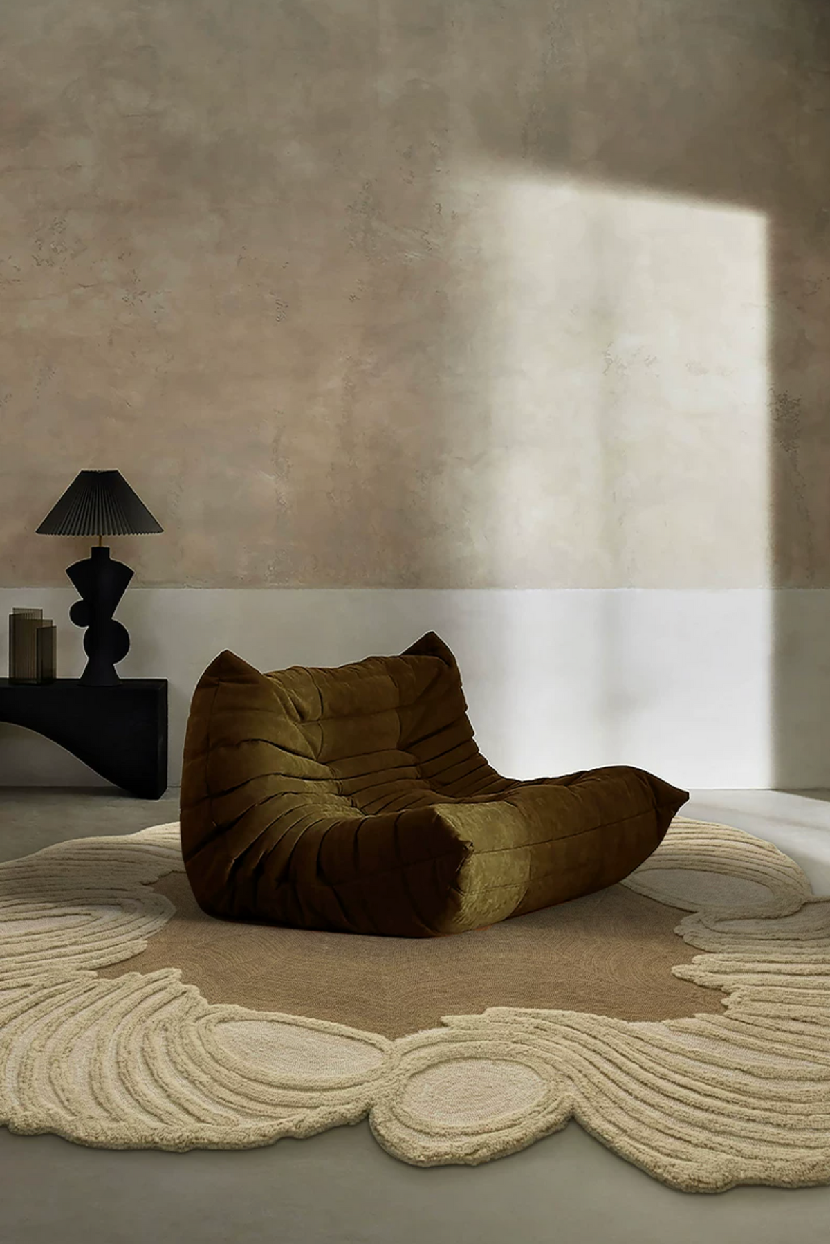Hewn Earth Studio Camellia rug featuring a soft, textured fabric with a floral-inspired design in earthy tones.