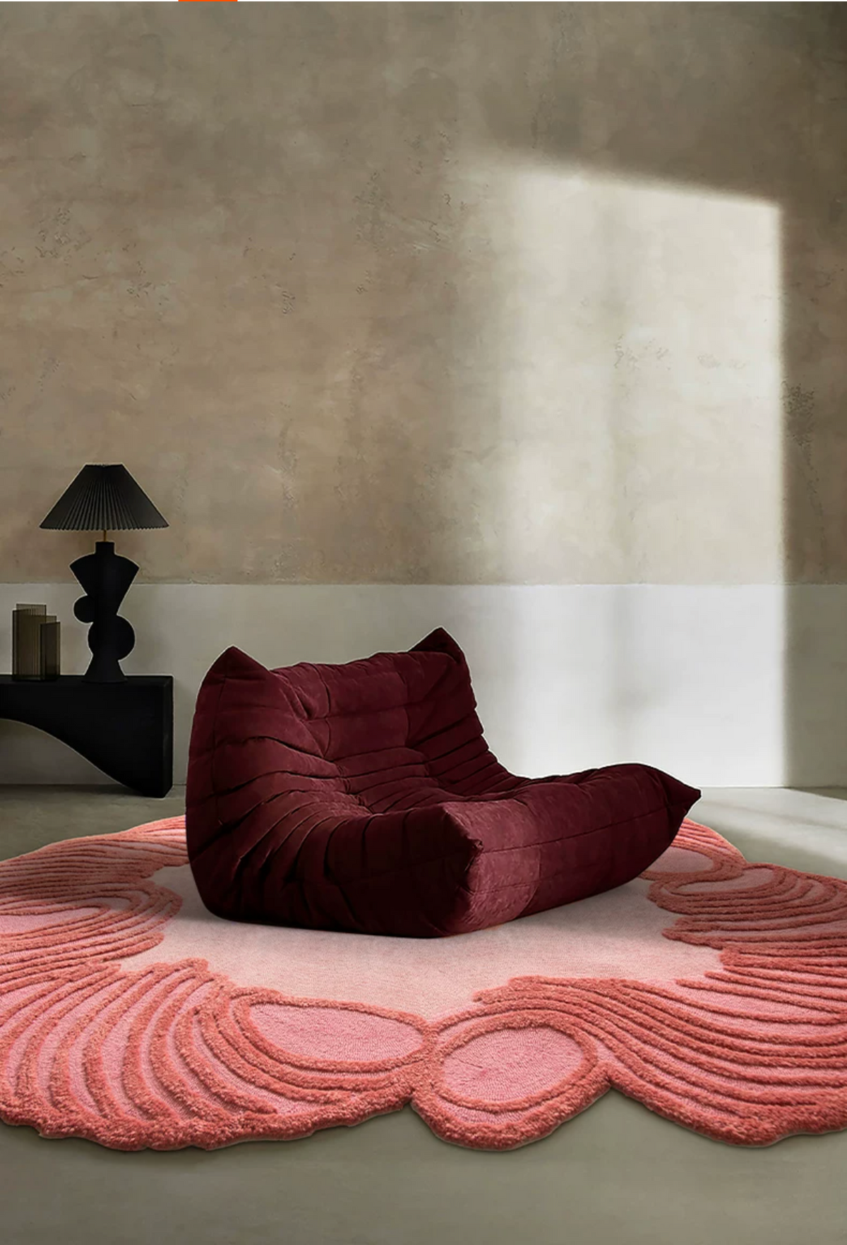 Hewn Earth Studio Camellia coral rug with intricate floral pattern, soft texture, and vibrant color for cozy living spaces.