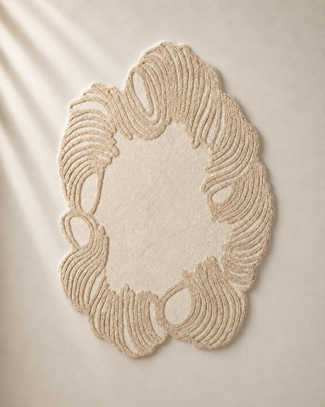 Hewn Earth Studio Camellia rug featuring intricate floral patterns in soft, natural tones on a textured fabric background.