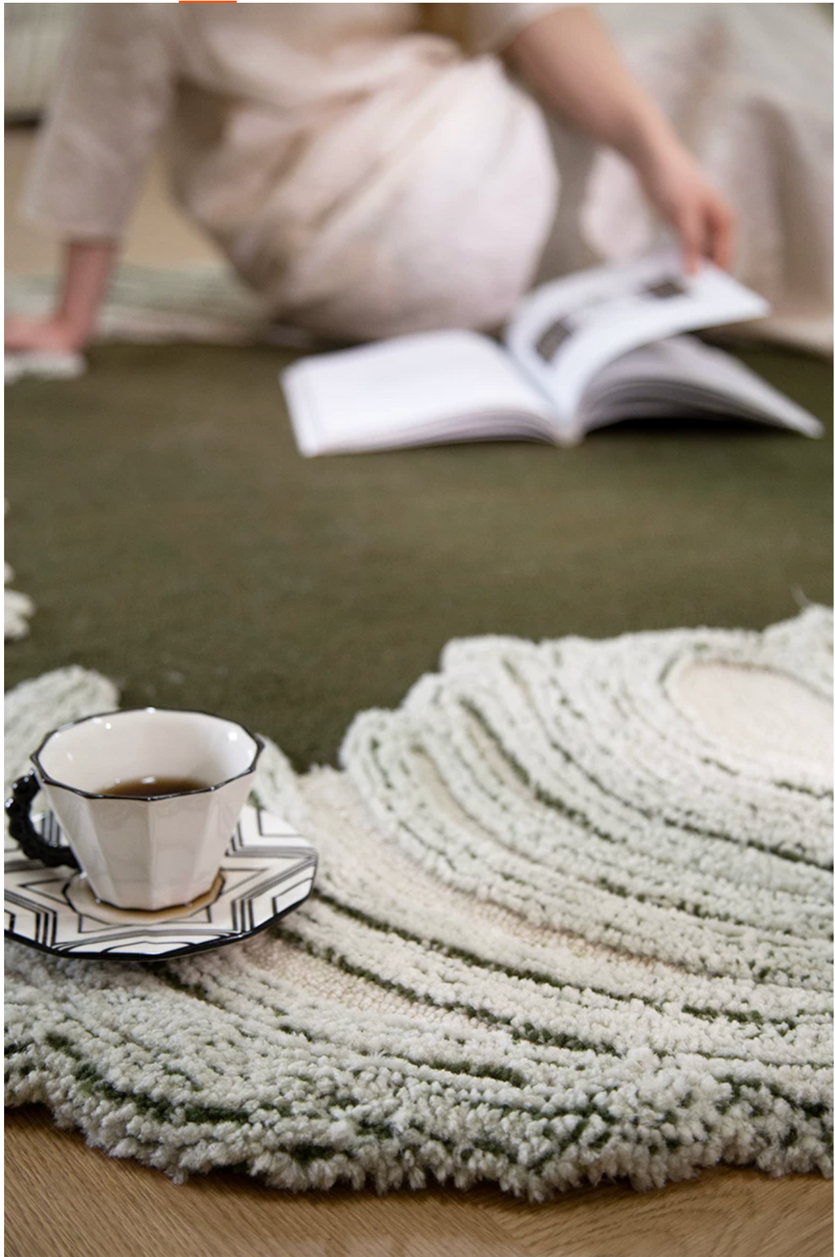 Hewn Earth Studio Camellia moss rug featuring a textured, floral-inspired design perfect for cozy interior decor.