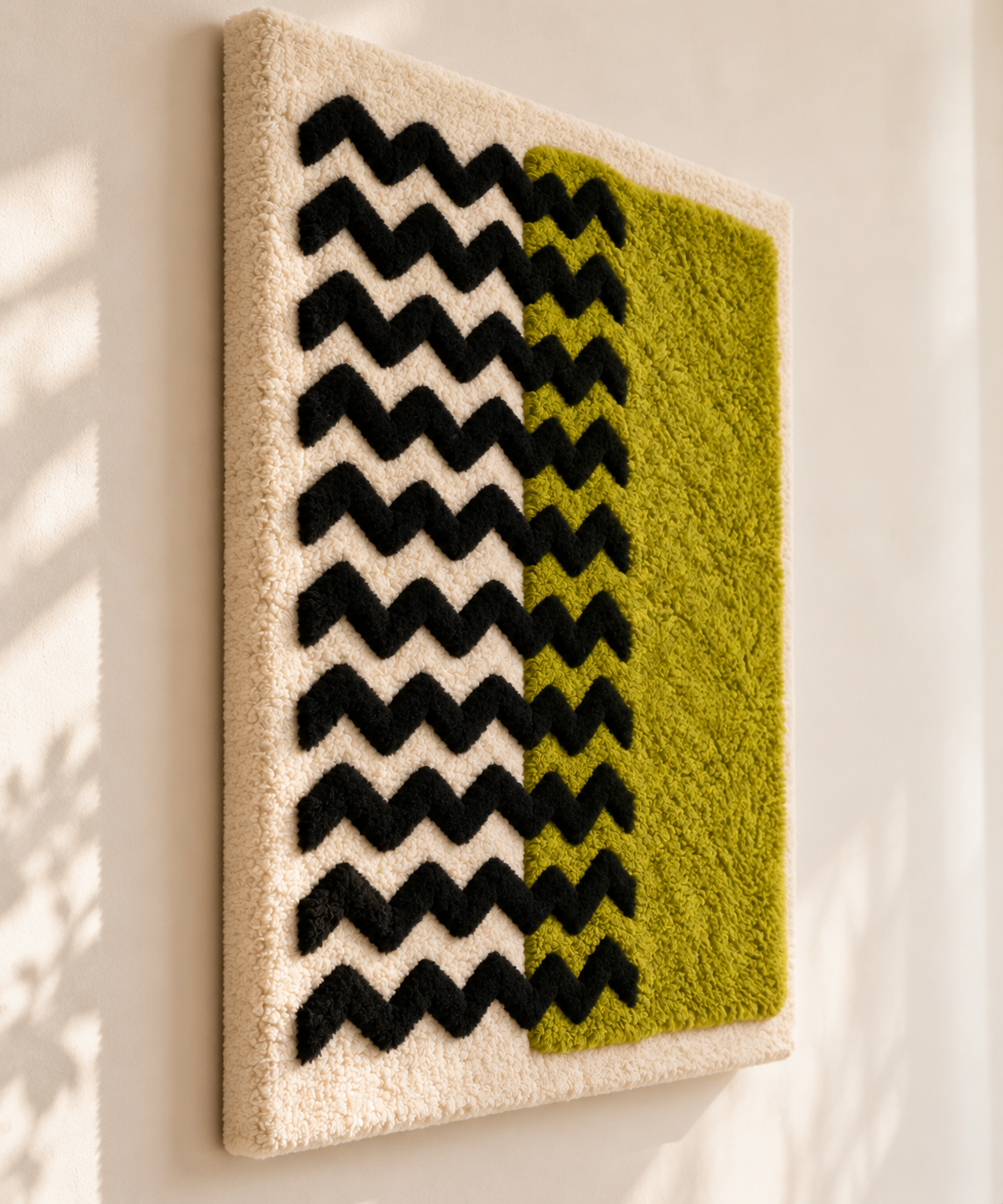Hewn Earth wall art featuring a chartreuse field and black chevron patterns, displayed at an angled view.