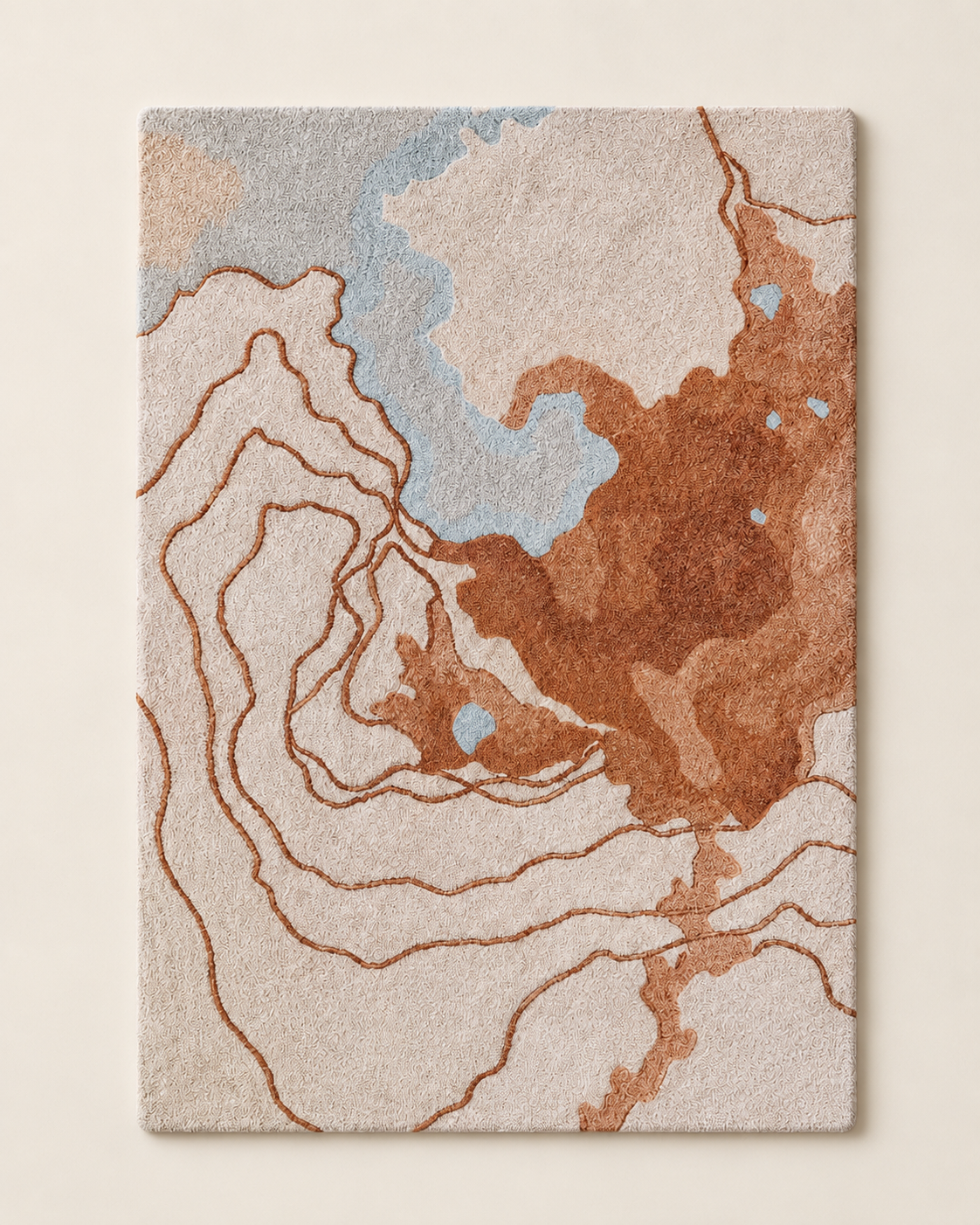 Delta rug by Hewn Earth Studio featuring intricate geometric patterns in earthy tones, perfect for adding warmth to living spaces.