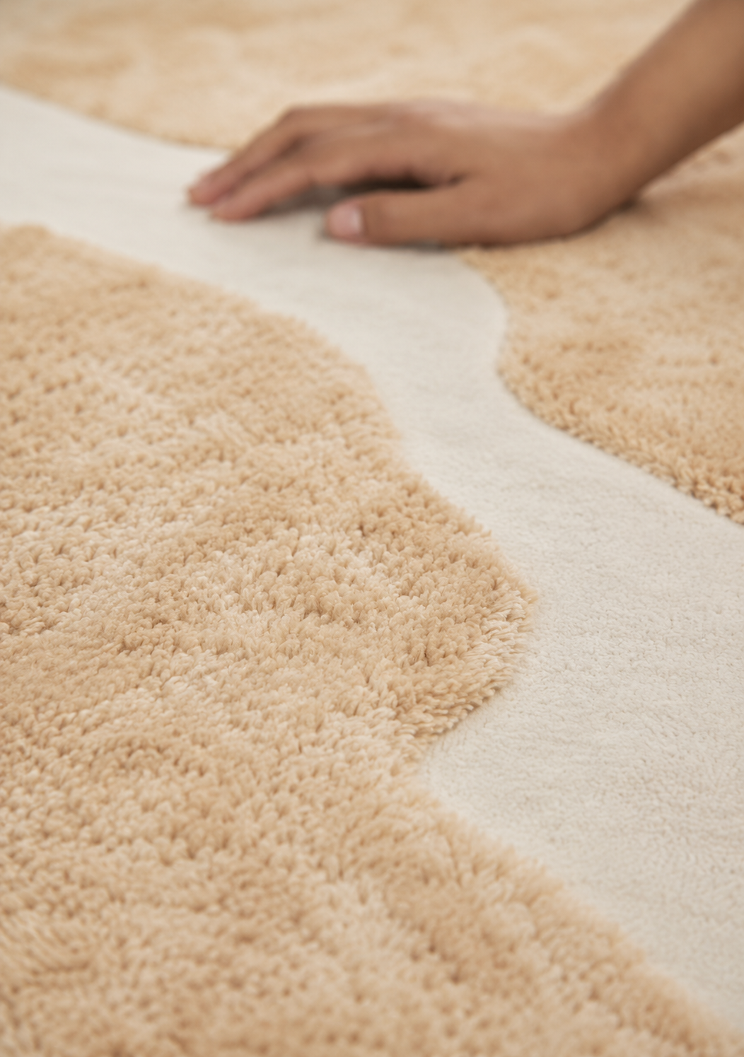 Hewn Earth Studio Bloom rug with a dune and floral pattern, showcasing soft, natural tones and intricate woven texture.