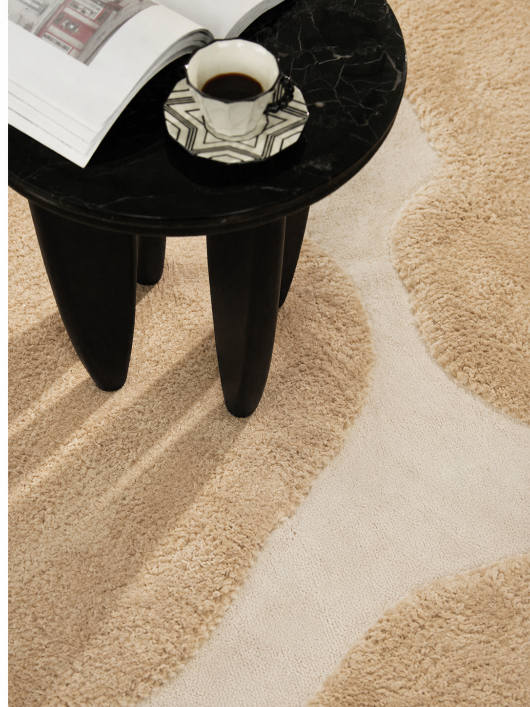 Hewn Earth Studio Bloom rug with dune and flora pattern, showcasing soft earth tones and intricate woven design on textured fabric.