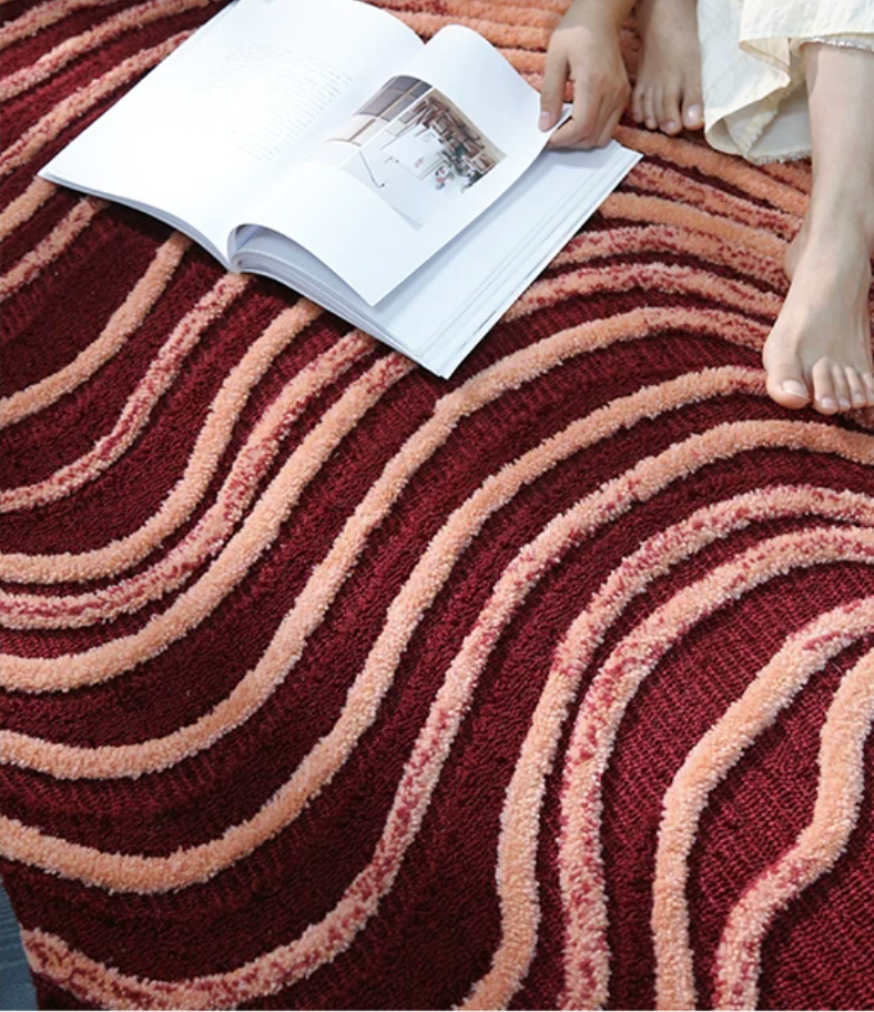 Handwoven Dune rug from Hewn Earth Studio featuring earthy tones and intricate patterns, showcasing detailed craftsmanship.