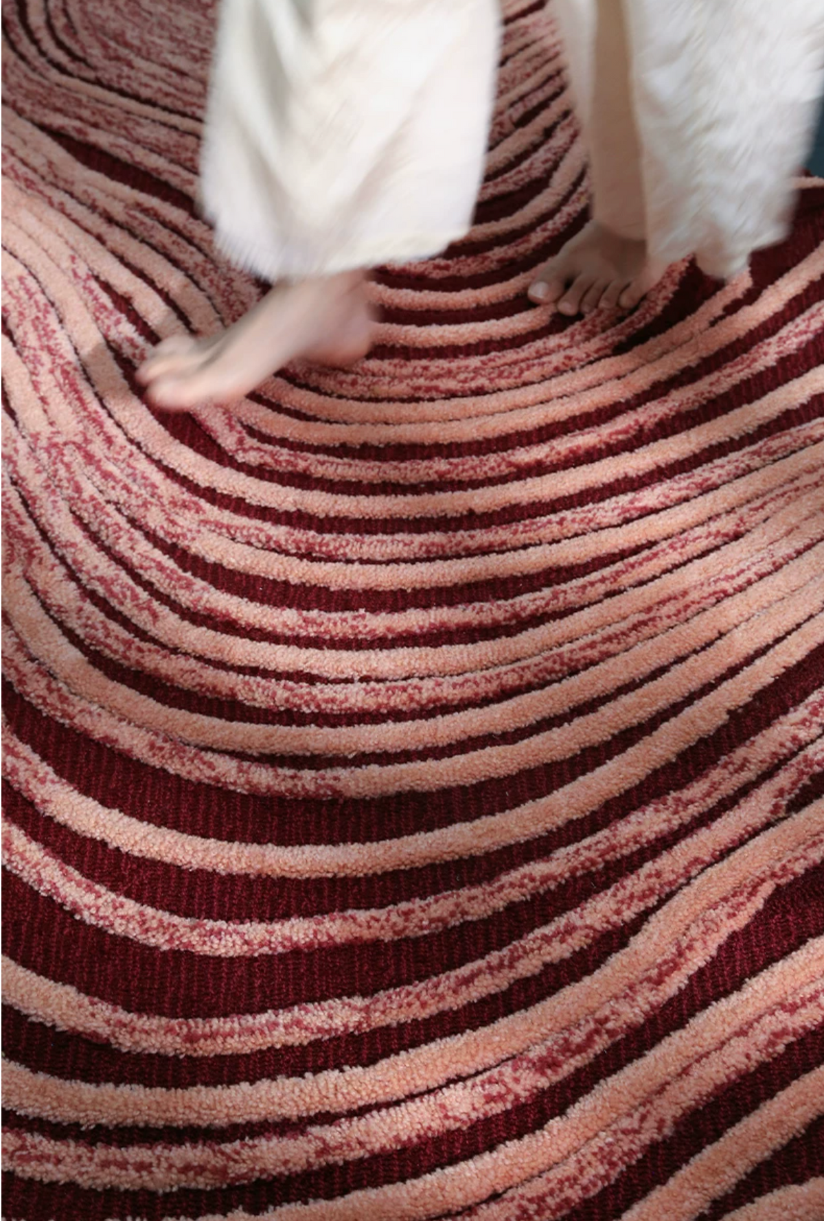 Close-up of Hewn Earth Studio Dune rug showing textured, earthy woven pattern and warm natural tones.