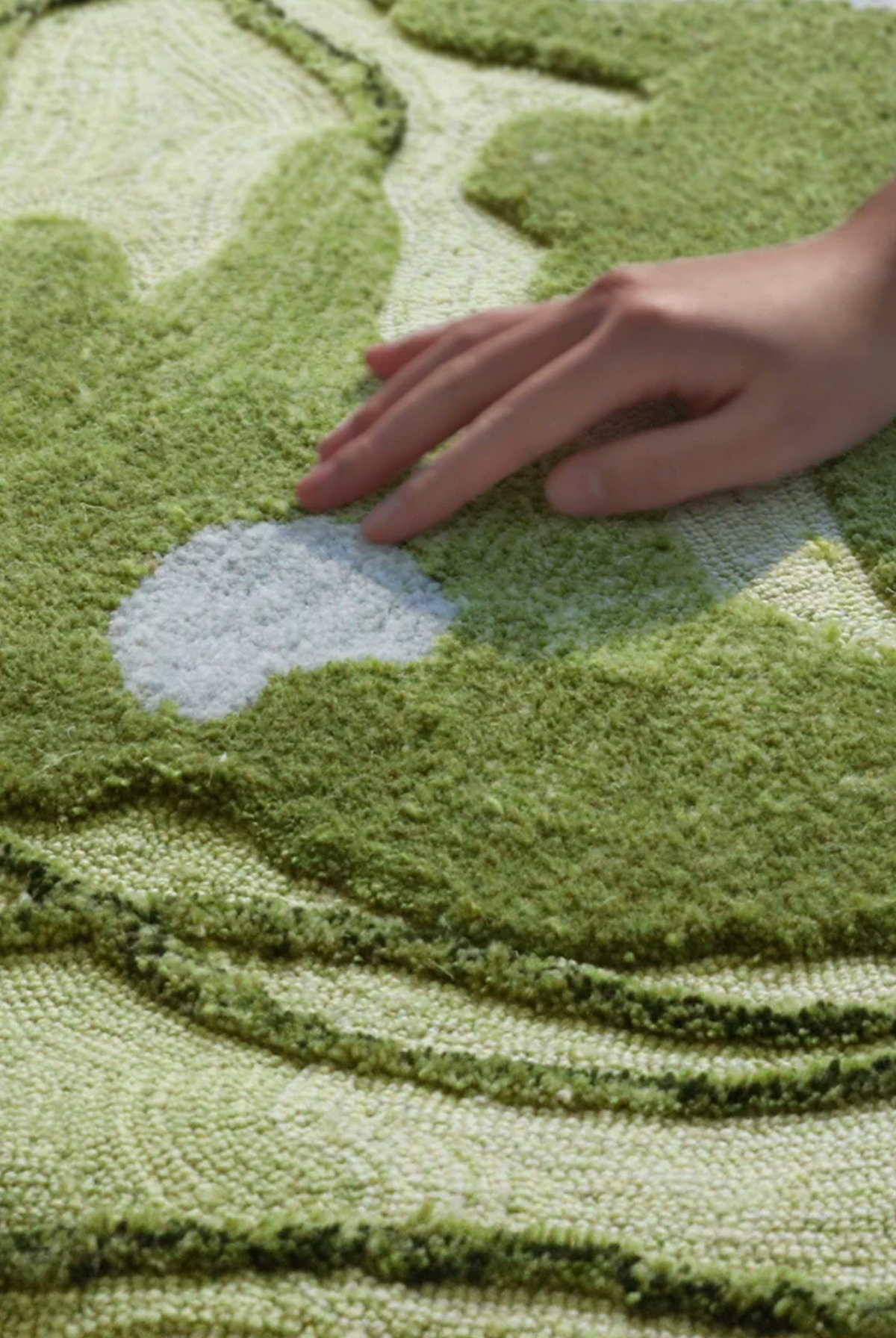 Hewn Earth Studio Fen rug with intricate woven design, showing the textured back side of the natural fiber rug.