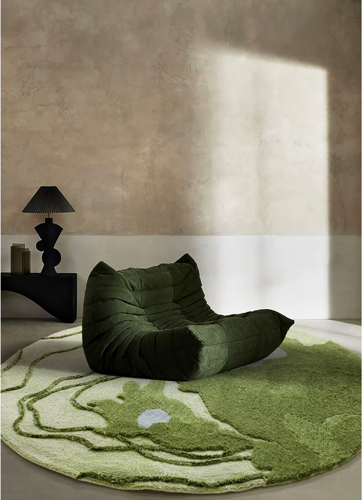 Hewn Earth Studio Fen rug featuring textured natural fibers and earthy tones, showcasing the intricate foot pattern design.