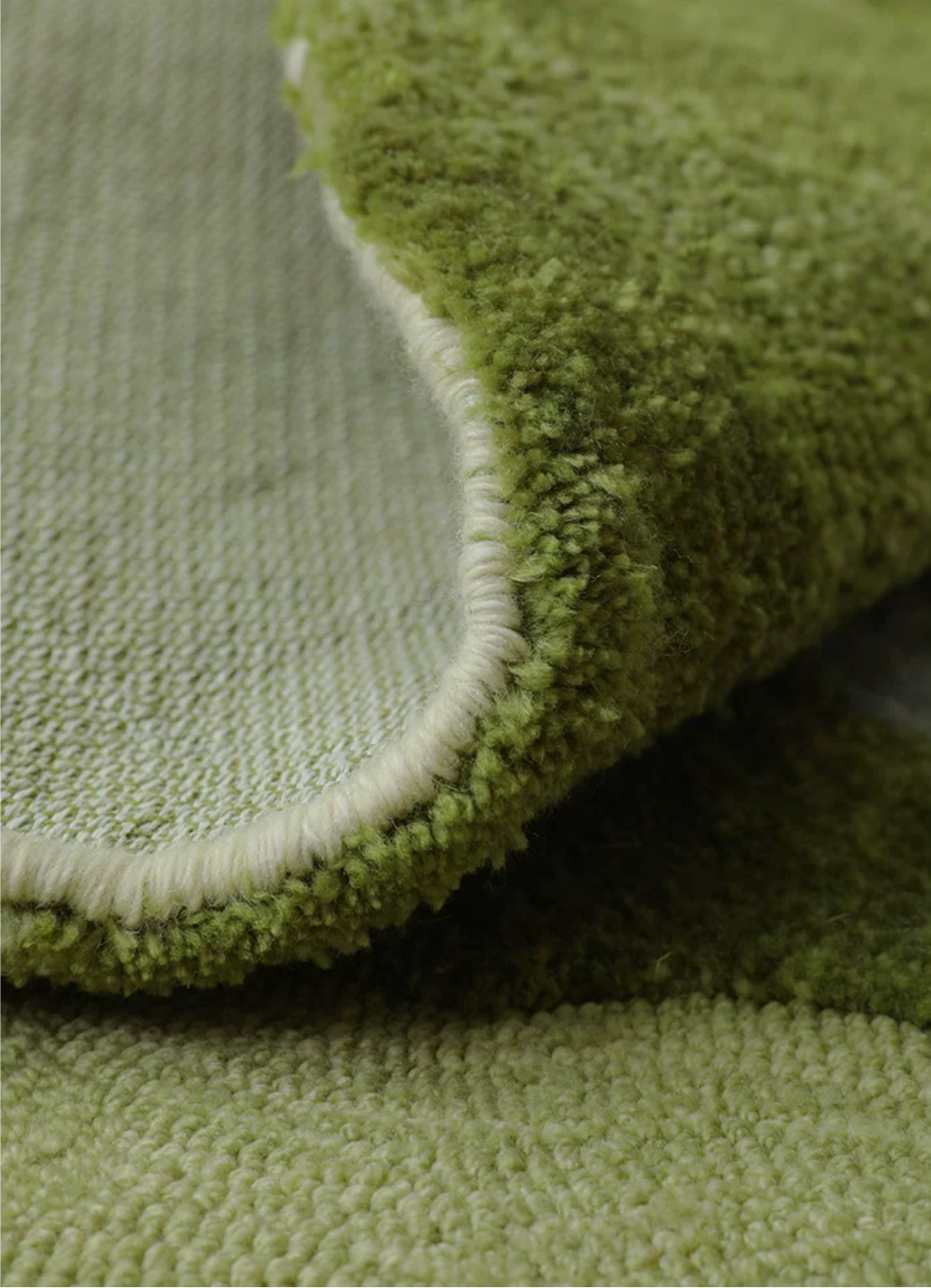 Close-up of Hewn Earth Studio Fen rug showing intricate woven texture and natural earthy tones.