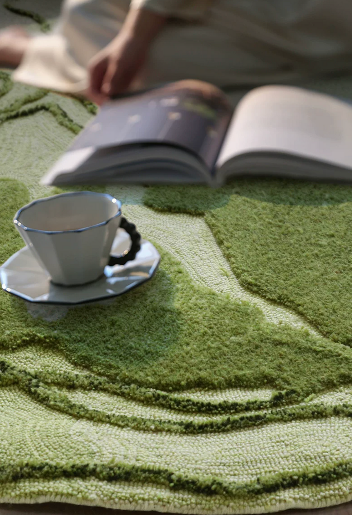 Hewn Earth Studio Fen rug with textured, woven design displayed in a cozy reading nook setting.