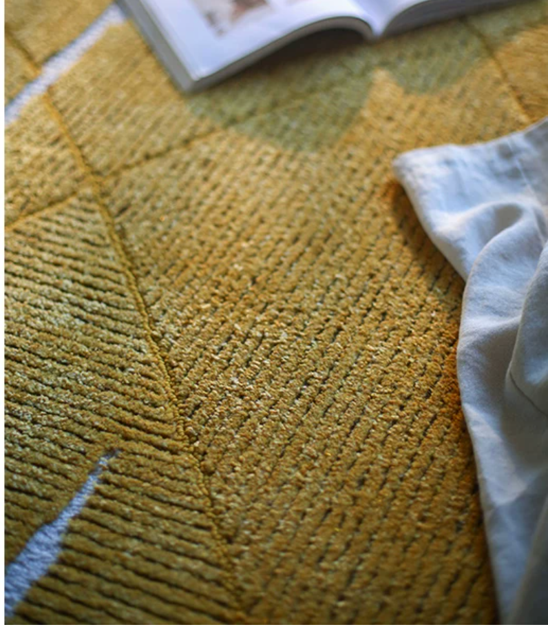 Hewn Earth Studio foil rug with shimmering metallic finish, showcasing its textured, reflective surface and modern design.