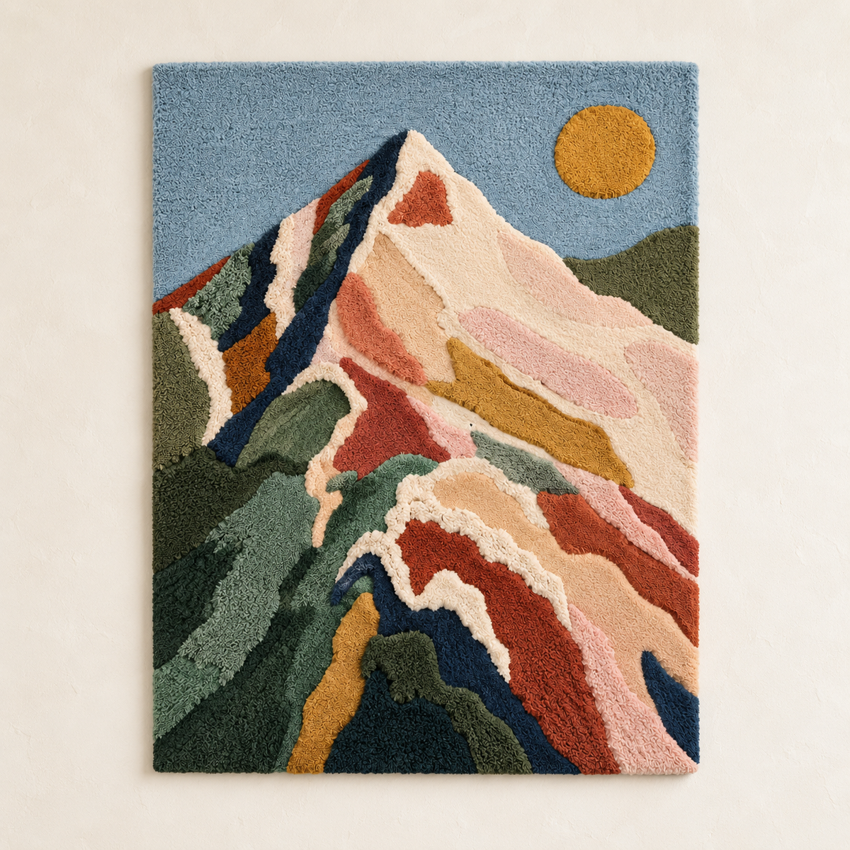 Hewn Earth wall art featuring a golden sun shining over a green mountain range, vibrant and artistic landscape decor.