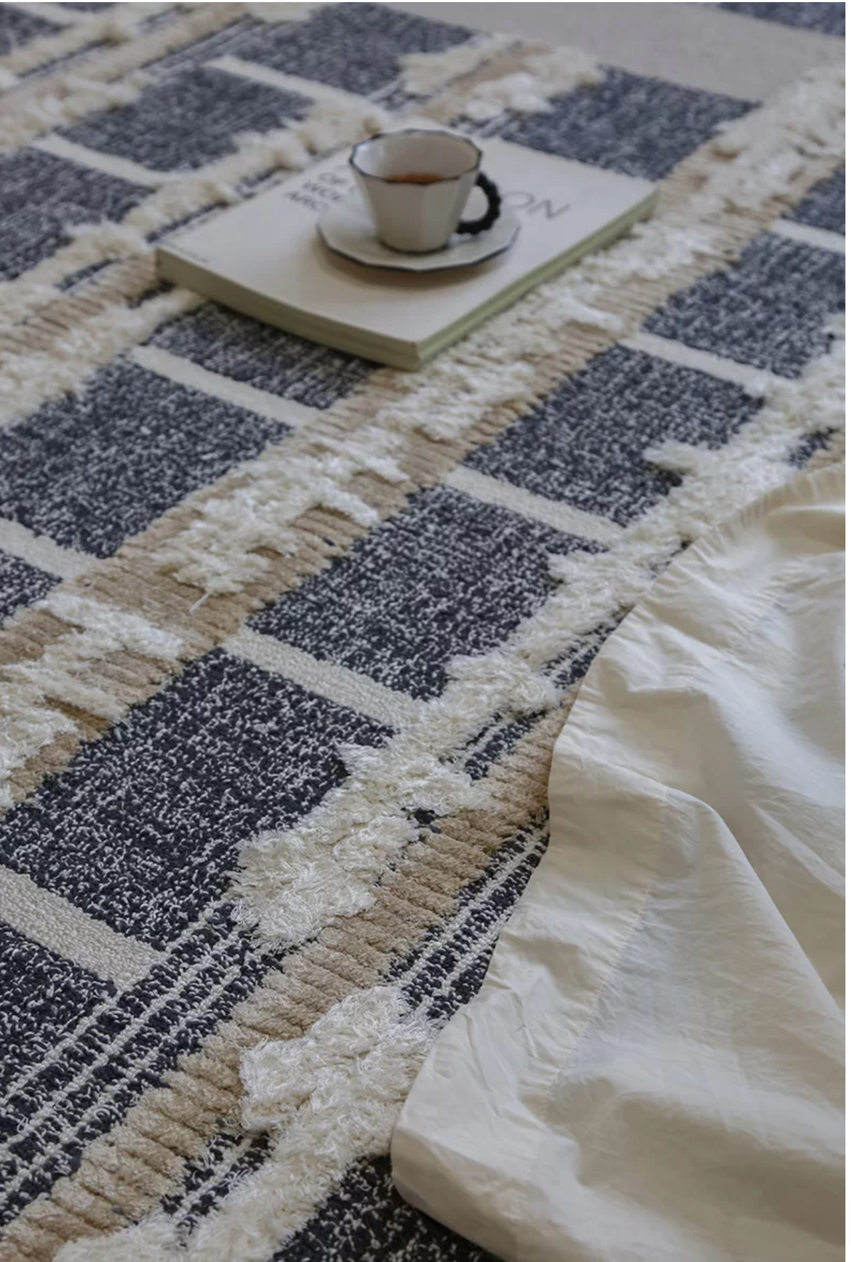 Hewn Earth Studio geometric grid rug with modern pattern, featuring clean lines and neutral colors for contemporary home decor