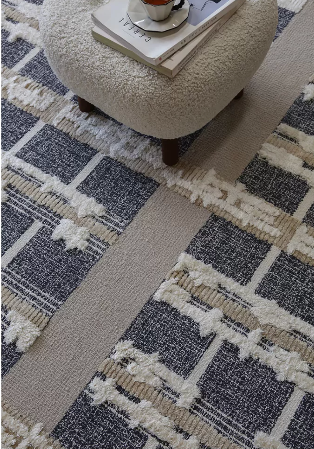 Hewn Earth Studio grid rug with geometric pattern, showcasing its modern design and textured fabric in a stylish room setting.