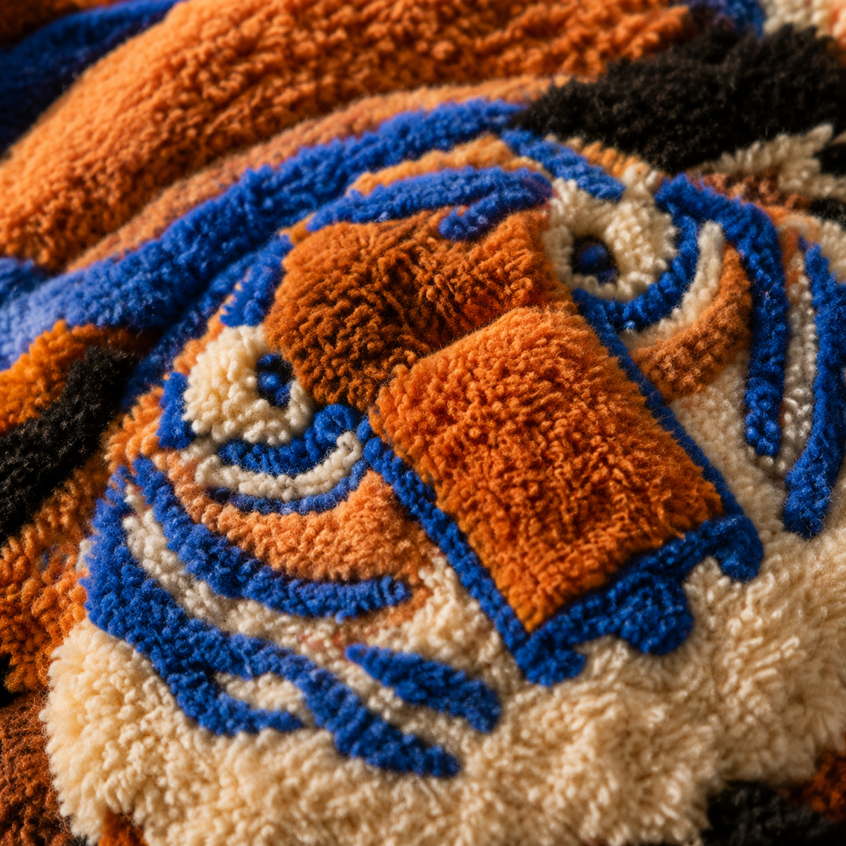 Close-up of Hewn Earth Indigo Tiger Thicket wall art showing detailed tiger and lush foliage in vibrant indigo and natural tones.