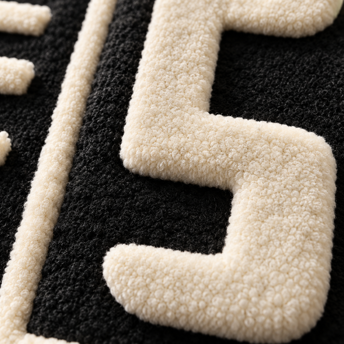 Close-up of Hewn Earth Ivory Circuit Labyrinth wall art showing intricate ivory circuit pattern on a textured surface.